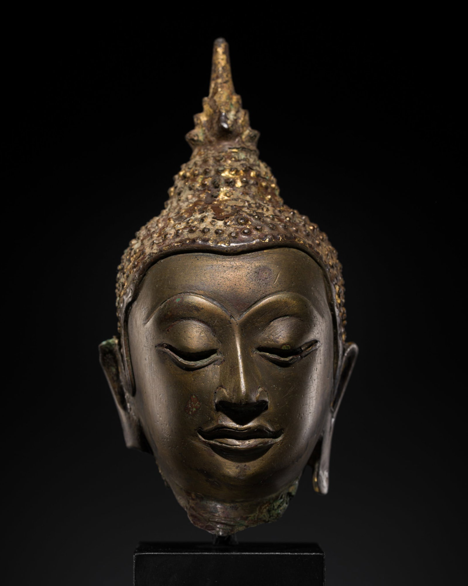 A FINE BRONZE HEAD OF BUDDHA SHAKYAMUNI, AYUTTHAYA KINGDOM, 15TH-16TH CENTURY: A FINE BRONZE HEAD OF BUDDHA SHAKYAMUNI, AYUTTHAYA KINGDOM, 15TH-16TH CENTURY This lot is from a single owner collection and is therefore offered without reserve The Jorgen Ruben Gallery Ledger, entry