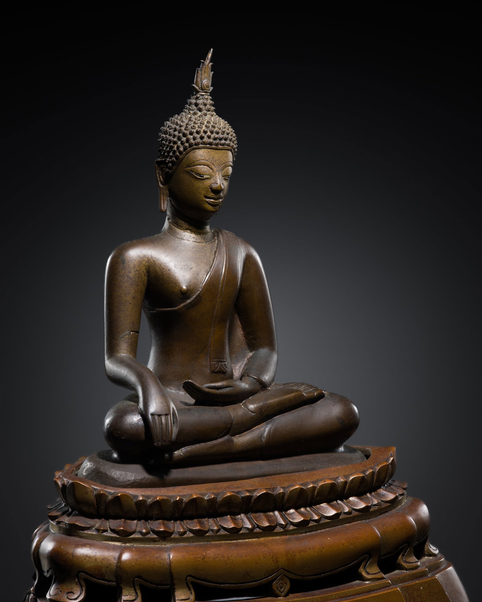 A BRONZE FIGURE OF BUDDHA SHAKYAMUNI, NORTHERN SUKOTHAI STYLE, 16TH CENTURY: A BRONZE FIGURE OF BUDDHA SHAKYAMUNI, NORTHERN SUKOTHAI STYLE, 16TH CENTURY This lot is from a single owner collection and is therefore offered without reserve The Jorgen Ruben Gallery Ledger, entry f