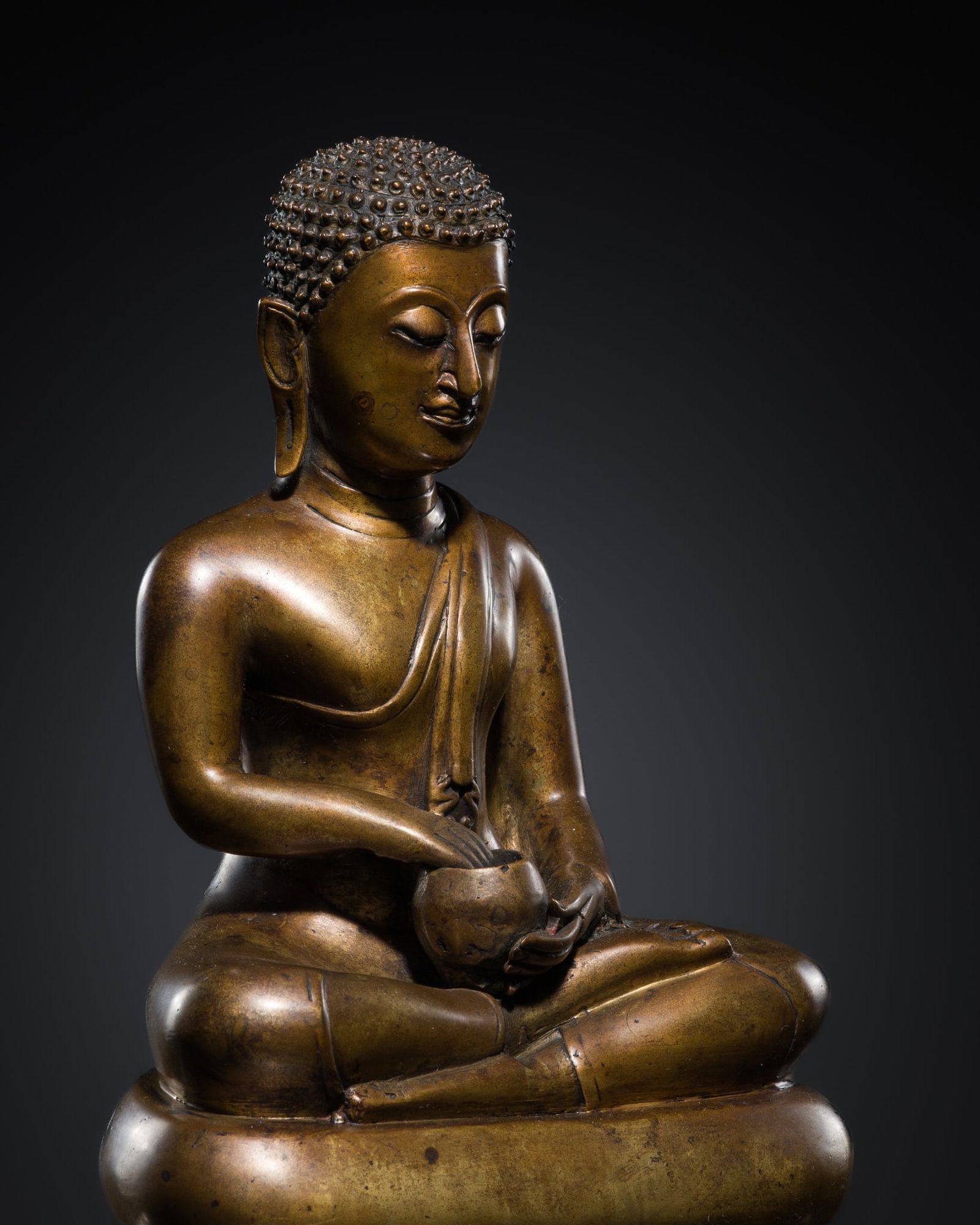 A BRONZE FIGURE OF A BUDDHIST DISCIPLE, 19TH CENTURY: A BRONZE FIGURE OF A BUDDHIST DISCIPLE, 19TH CENTURY This lot is from a single owner collection and is therefore offered without reserve The Jorgen Ruben Gallery Ledger, entry from 2005: “No. 28