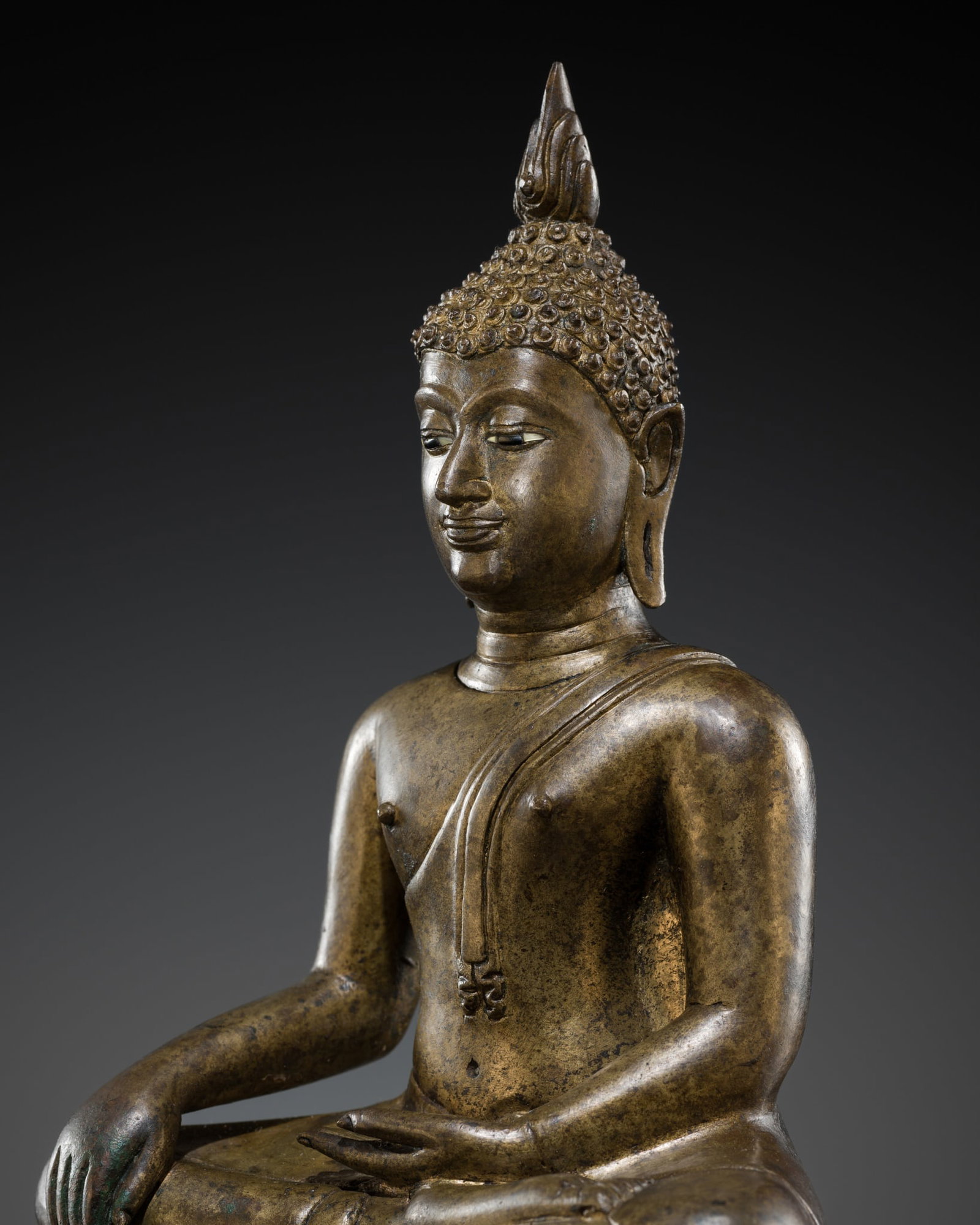 A BRONZE FIGURE OF BUDDHA SHAKYAMUNI, CHIENG SEN STYLE, RATANAKOSIN PERIOD, 19TH CENTURY: A BRONZE FIGURE OF BUDDHA SHAKYAMUNI, CHIENG SEN STYLE, RATANAKOSIN PERIOD, 19TH CENTURY This lot is from a single owner collection and is therefore offered without reserve The Jorgen Ruben Gallery Le