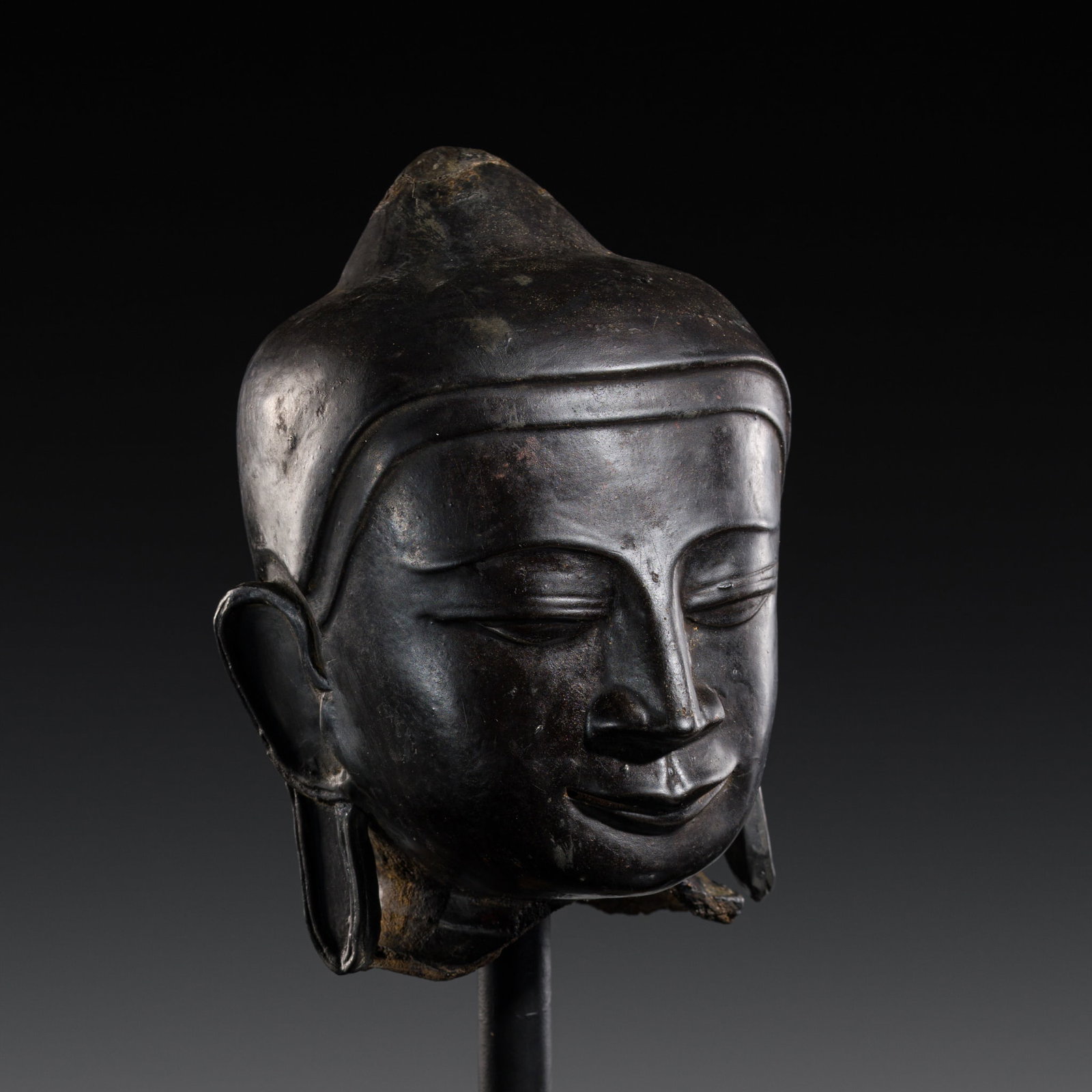 A DRY LACQUER HEAD OF BUDDHA SHAKYAMUNI, AVA STYLE, 17TH -18TH CENTURY: A DRY LACQUER HEAD OF BUDDHA SHAKYAMUNI, AVA STYLE, 17TH -18TH CENTURY This lot is from a single owner collection and is therefore offered without reserve Burma / Myanmar. Finely modeled, the well-def