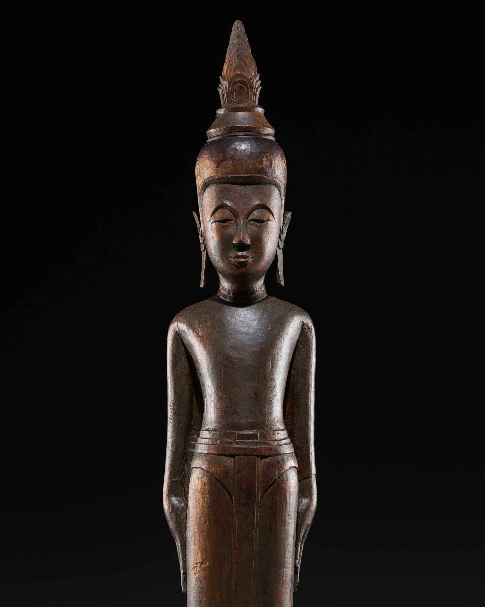 A VERY RARE WOOD FIGURE OF BUDDHA, LUANG PRABANG STYLE, 17TH-18TH CENTURY: A VERY RARE WOOD FIGURE OF BUDDHA, LUANG PRABANG STYLE, 17TH-18TH CENTURY This lot is from a single owner collection and is therefore offered without reserve Laos. Boldly carved standing in samabhanga
