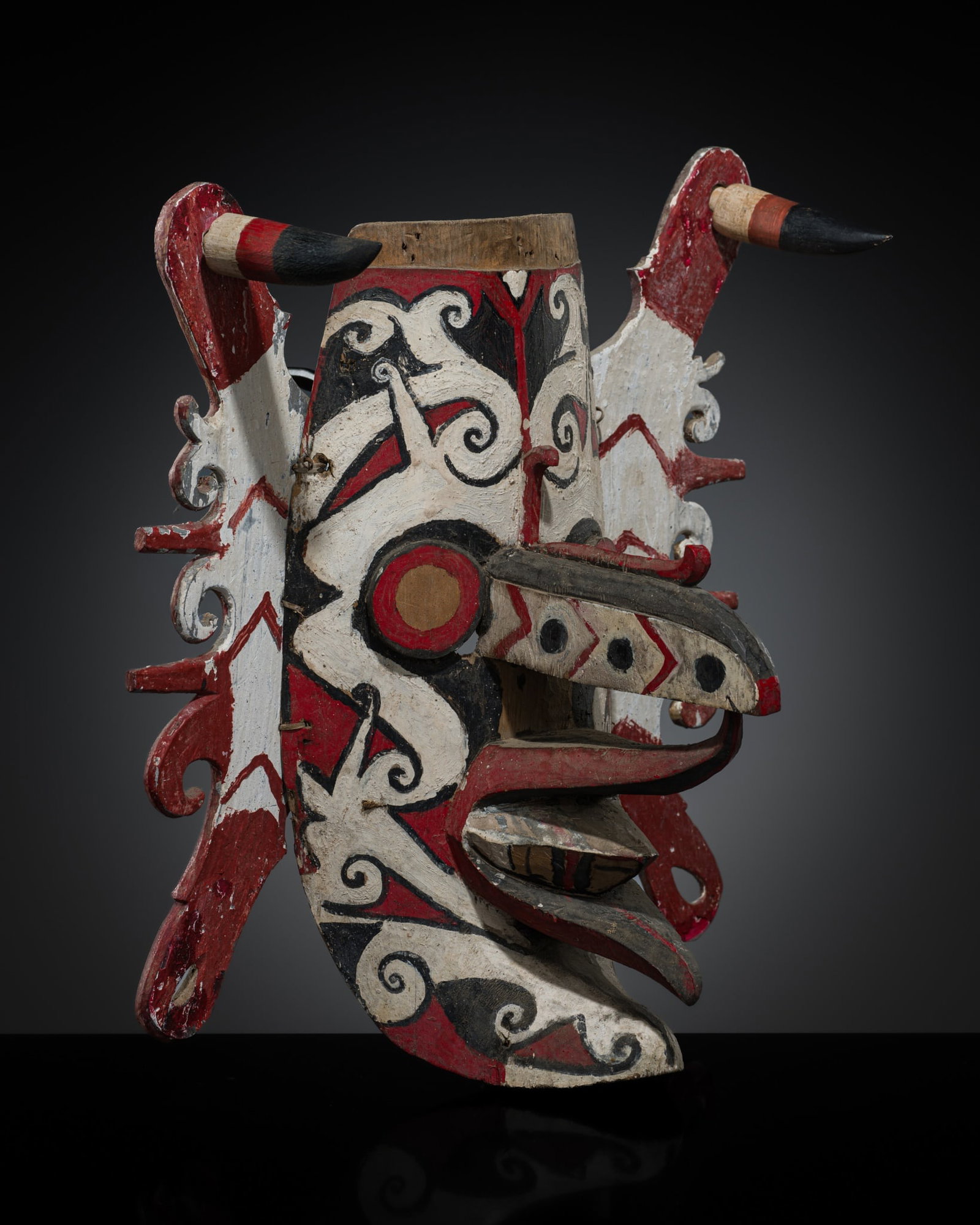 A DAYAK POLYCHROME WOOD HUDOQ MASK, 20TH CENTURY: A DAYAK POLYCHROME WOOD HUDOQ MASK, 20TH CENTURY This lot is from a single owner collection and is therefore offered without reserve Indonesia, Central Borneo, East Kalimantan. Boldly carved, of oval 