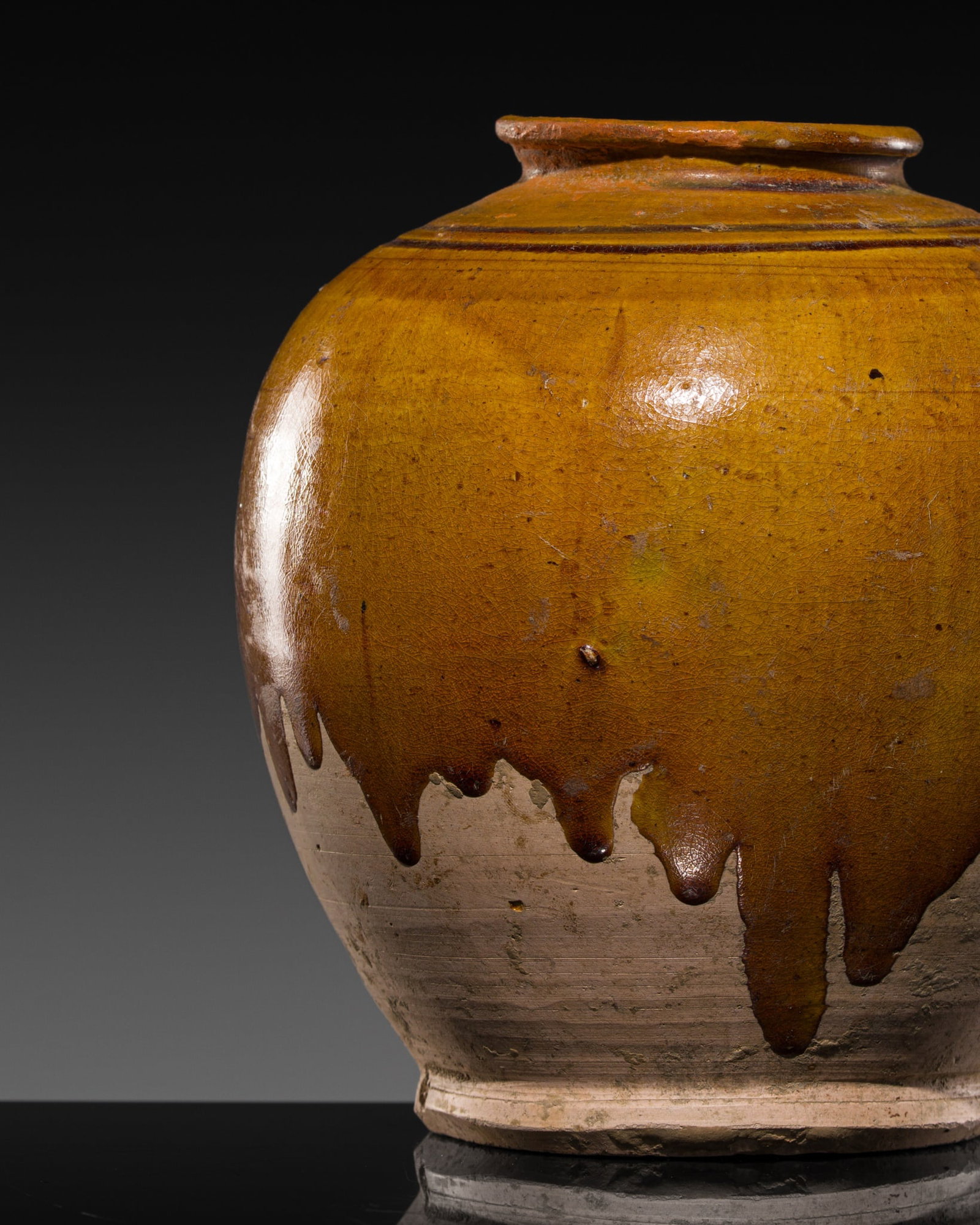 AN AMBER-GLAZED POTTERY JAR, TANG DYNASTY (1 of 13)