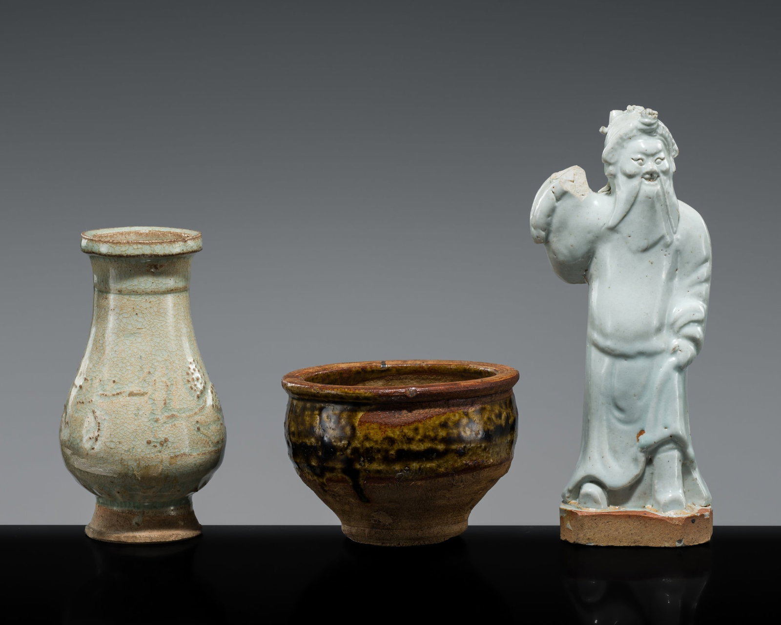 A GROUP LOT WITH A QINGBAI HU VASE, A QINGBAI IMMORTAL AND A BROWN-GLAZED YUAN DYNASTY BOWL (1 of 10)