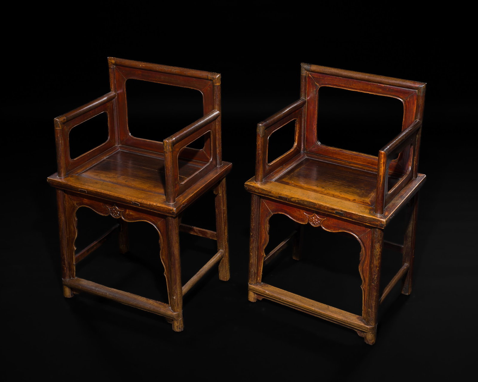 A PAIR OF LOW BACK HARDWOOD ARMCHAIRS, MEIGUIYI, QING DYNASTY: A PAIR OF LOW BACK HARDWOOD ARMCHAIRS, MEIGUIYI, QING DYNASTY This lot is from a single owner collection and is therefore offered without reserve China, 1644-1912. Each with a rectangular open backres