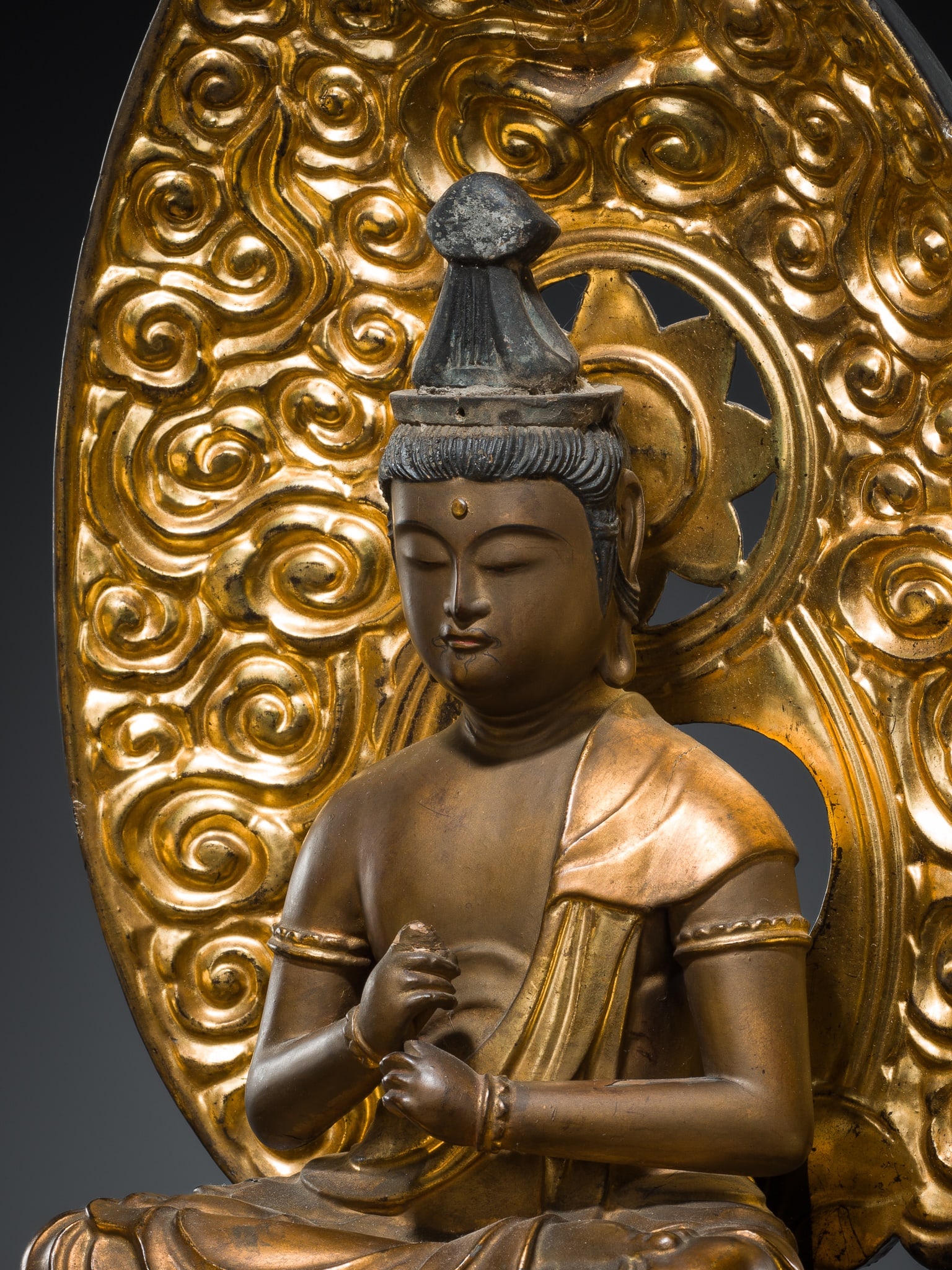 A FINE GILT-LACQUERED WOOD FIGURE OF DAINICHI NYORAI (MAHAVAIROCANA), EDO PERIOD: A FINE GILT-LACQUERED WOOD FIGURE OF DAINICHI NYORAI (MAHAVAIROCANA), EDO PERIOD This lot is from a single owner collection and is therefore offered without reserve Japan, 1615-1868. Of yosegi (joined