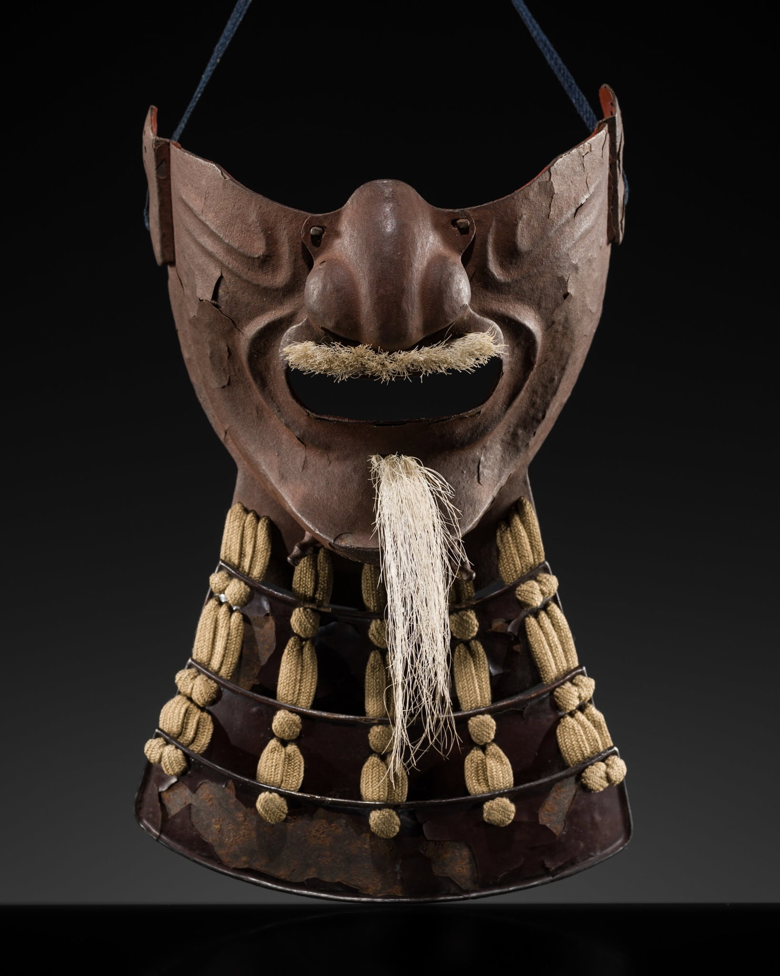A LACQUERED IRON MENPO, EDO PERIOD (1 of 13)