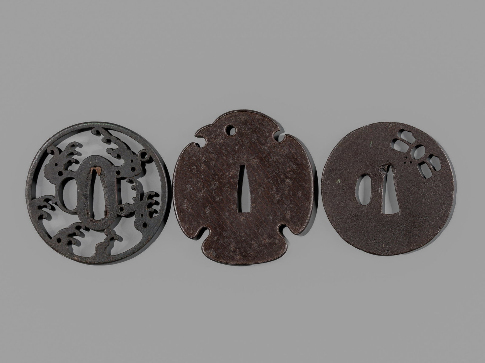 A GROUP OF THREE IRON TSUBA, EDO PERIOD (1 of 11)