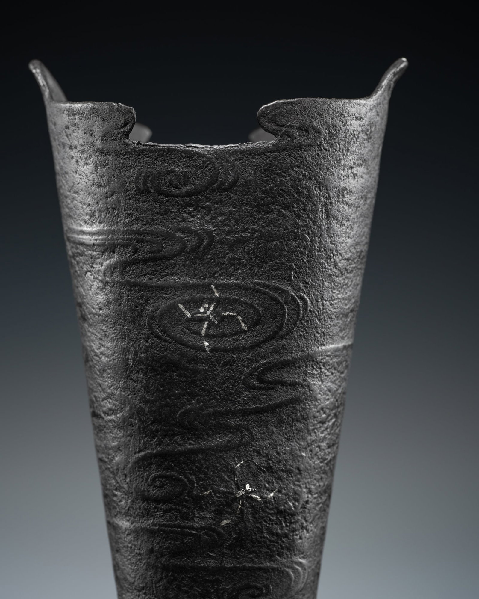 A SILVER-INLAID IRON 'WATER STRIDERS' IKEBANA VASE, MEIJI PERIOD: A SILVER-INLAID IRON 'WATER STRIDERS' IKEBANA VASE, MEIJI PERIOD This lot is from a single owner collection and is therefore offered without reserve Japan, 1868-1912. Of bucket-form, rising from a fla
