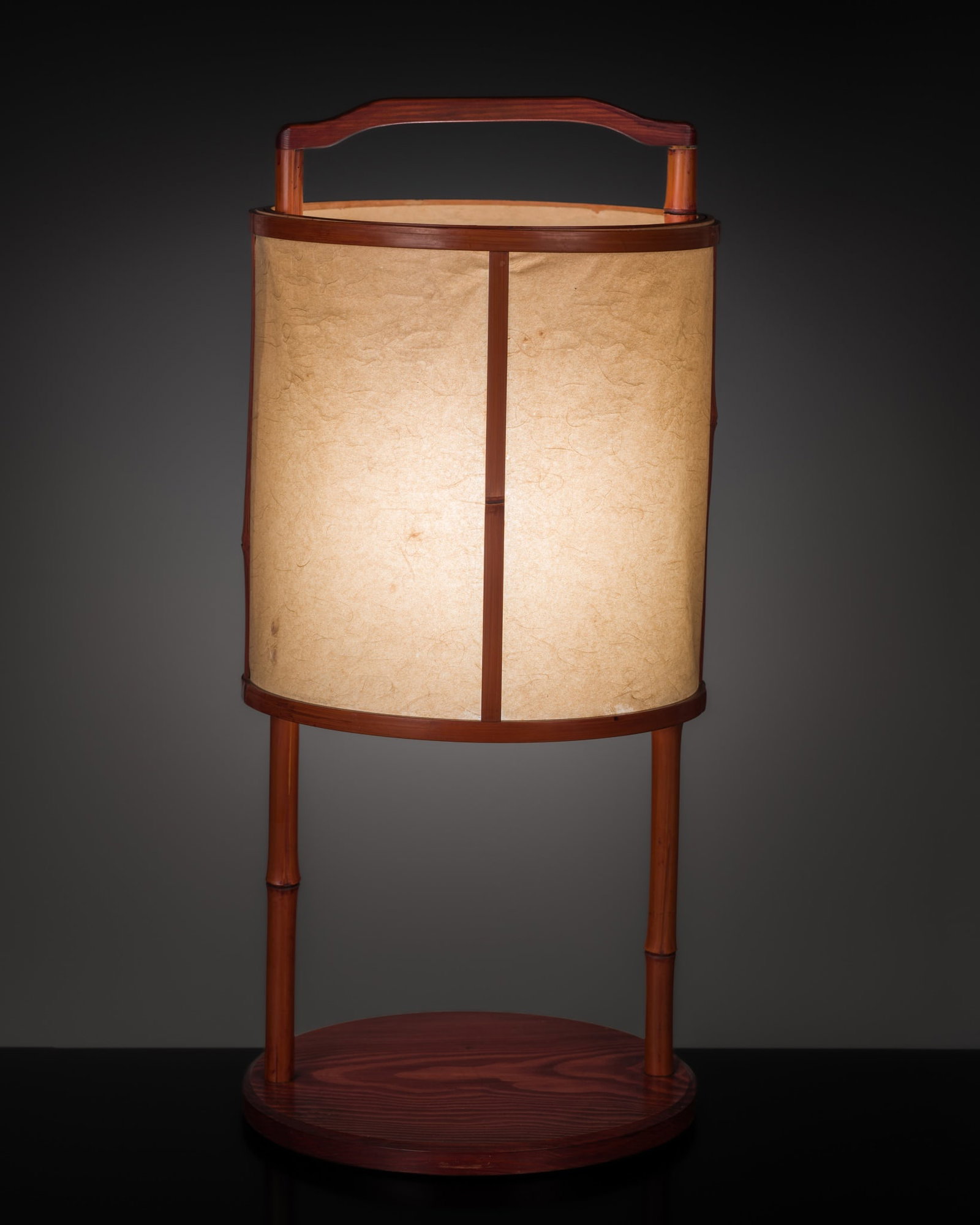 KOMAZAWA RISAI: A WOOD ENSHU ANDON, LANTERN, LATE MEIJI-TAISHO: KOMAZAWA RISAI: A WOOD ENSHU ANDON, LANTERN, LATE MEIJI-TAISHO This lot is from a single owner collection and is therefore offered without reserve Japan, circa 1900. Of tall cylindrical form, the pape