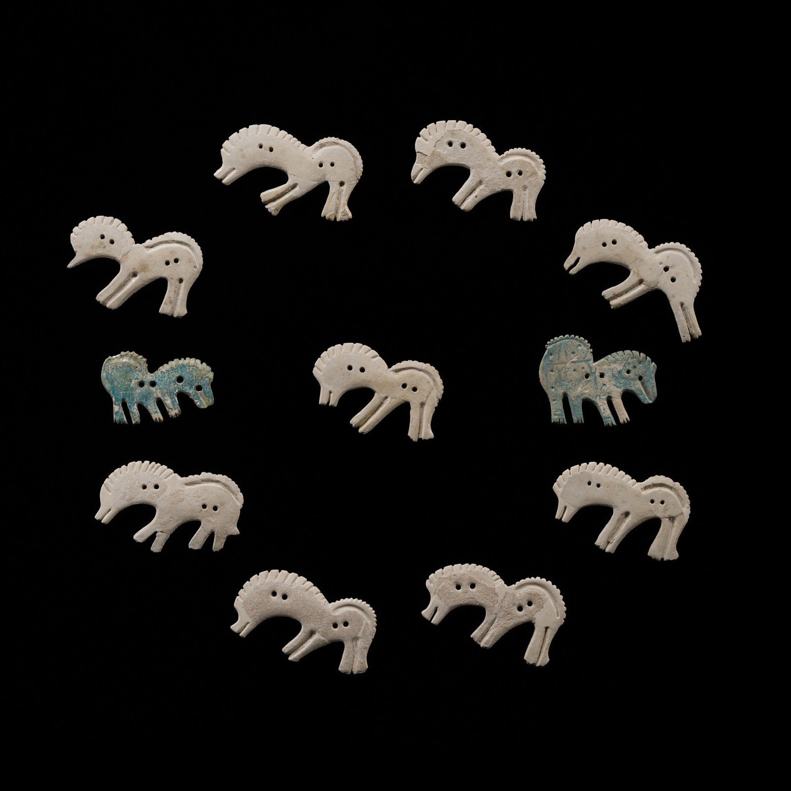 A RARE GROUP OF ELEVEN SCYTHIAN FAIENCE HORSE PLAQUES, 9TH-8TH CENTURY BC (1 of 12)