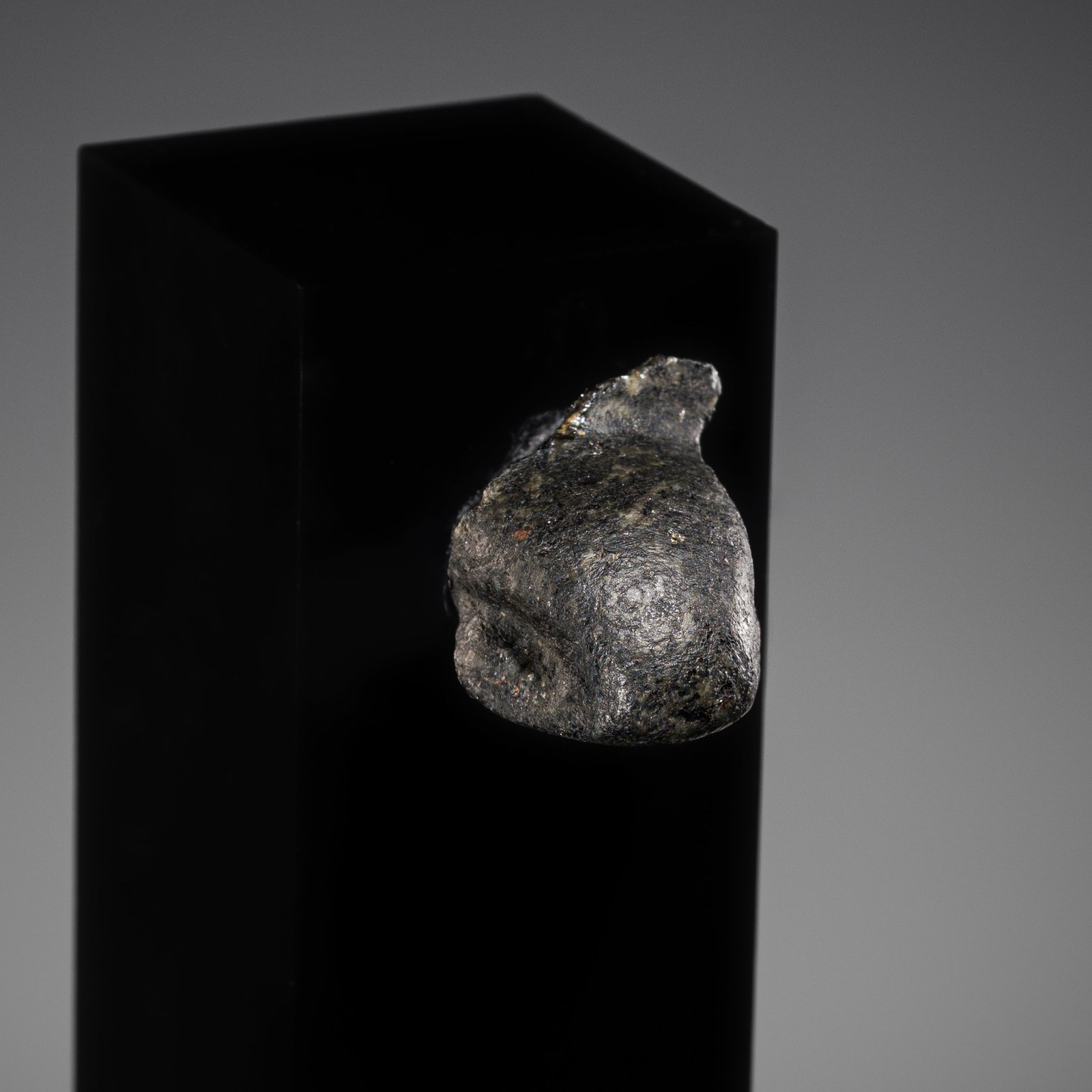 A BASALT FRAGMENTARY HEAD OF AN UREAUS, LATE PERIOD: A BASALT FRAGMENTARY HEAD OF AN UREAUS, LATE PERIOD This lot is from a single owner collection and is therefore offered without reserve Egypt, 664-332 BC. Boldly carved, the pointed head of the serpen