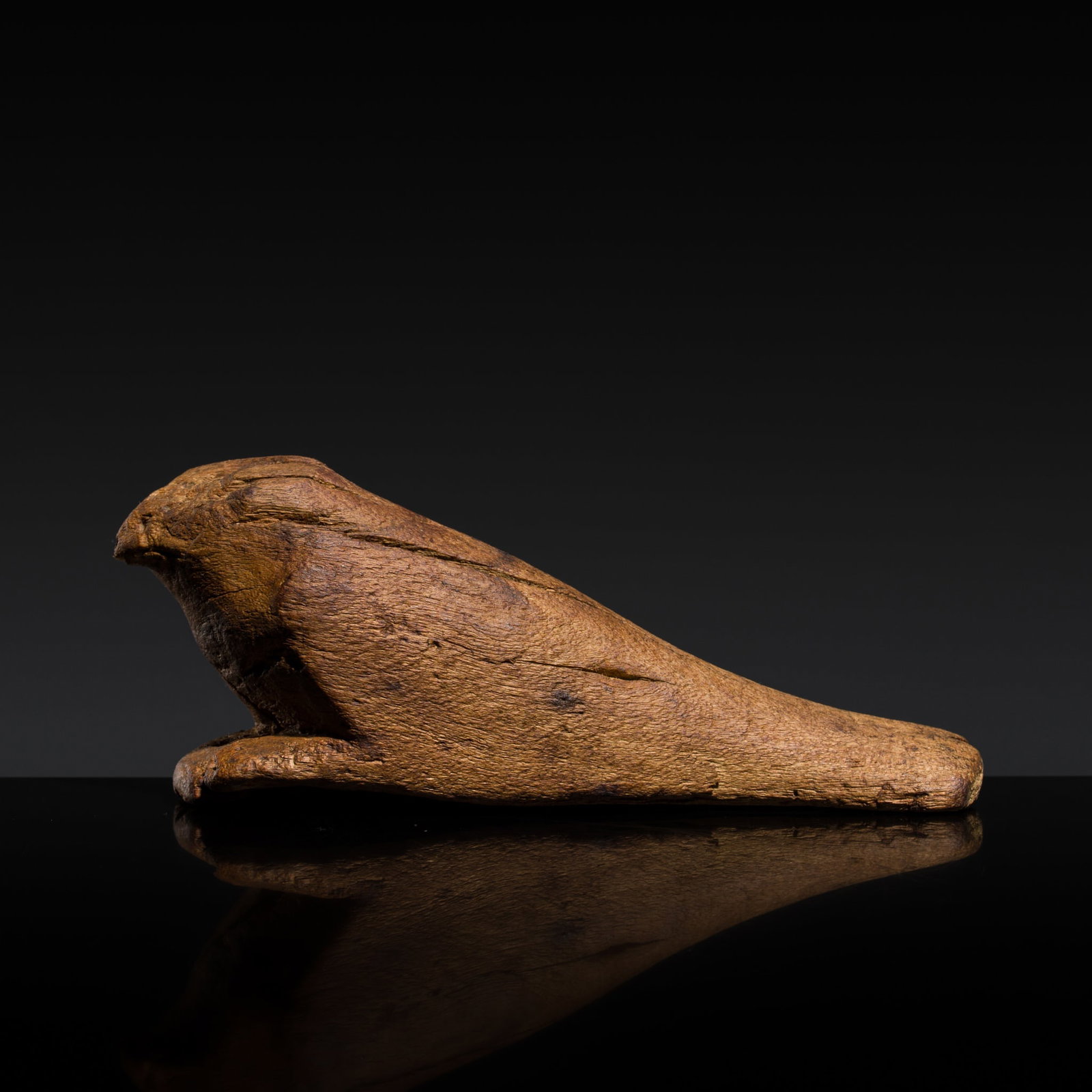 A WOOD FIGURE OF A MUMMIFIED FALCON, LATE PERIOD: A WOOD FIGURE OF A MUMMIFIED FALCON, LATE PERIOD This lot is from a single owner collection and is therefore offered without reserve The Jorgen Ruben Gallery Ledger, entry from 2005: “No. 103, B