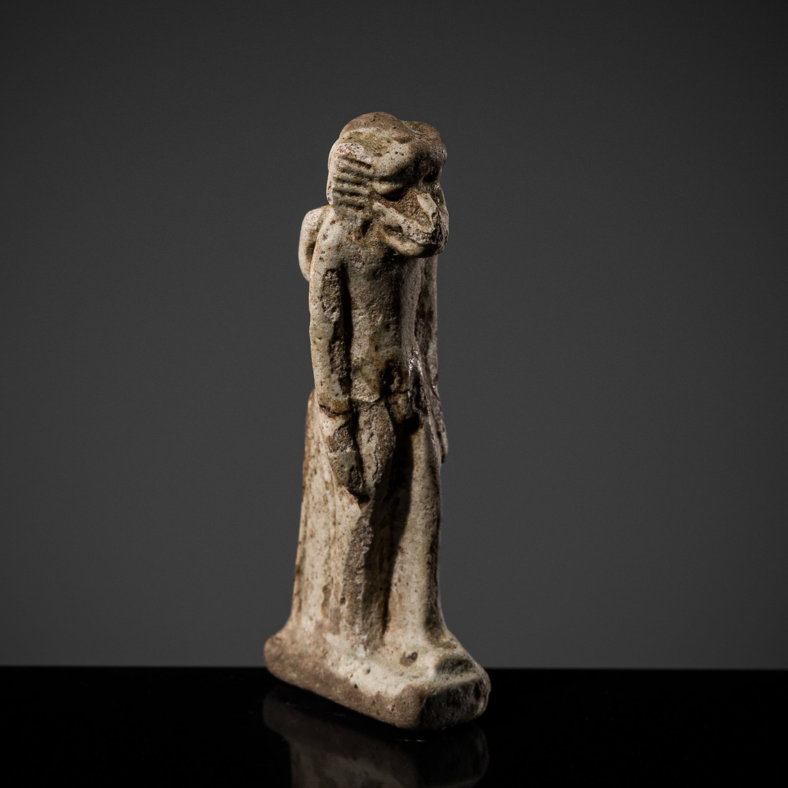 AN EGYPTIAN GLAZED STEATITE 'THOTH' AMULET, LATE PERIOD-PTOLEMAIC PERIOD: AN EGYPTIAN GLAZED STEATITE 'THOTH' AMULET, LATE PERIOD-PTOLEMAIC PERIOD This lot is from a single owner collection and is therefore offered without reserve Egypt, 664-30 BC. Boldly modeled standing i