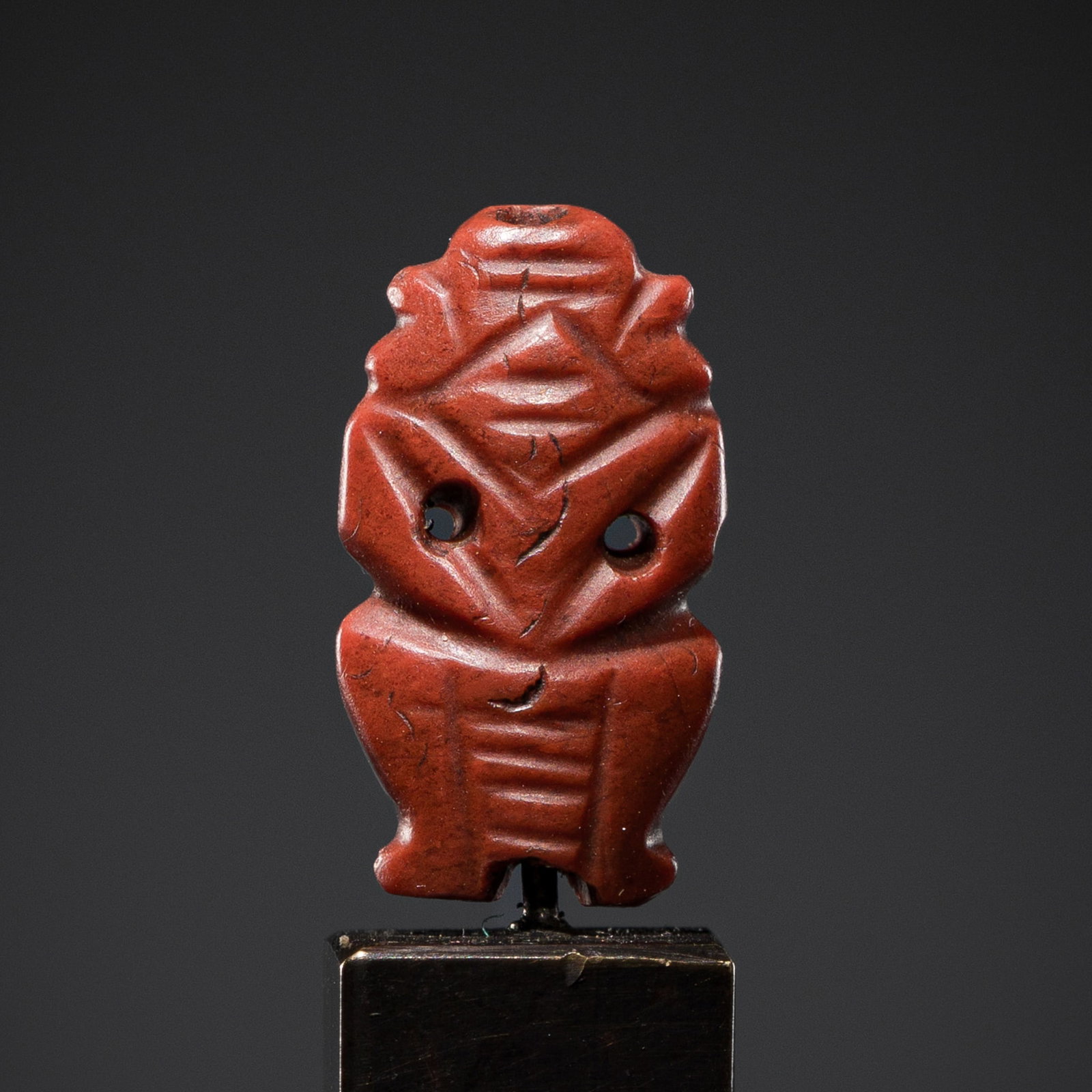 A JASPER AMULET OF BES, NEW KINGDOM, DYNASTY XVIII: A JASPER AMULET OF BES, NEW KINGDOM, DYNASTY XVIII This lot is from a single owner collection and is therefore offered without reserve The Jorgen Ruben Gallery Ledger, entry from 2012: “No. 729,