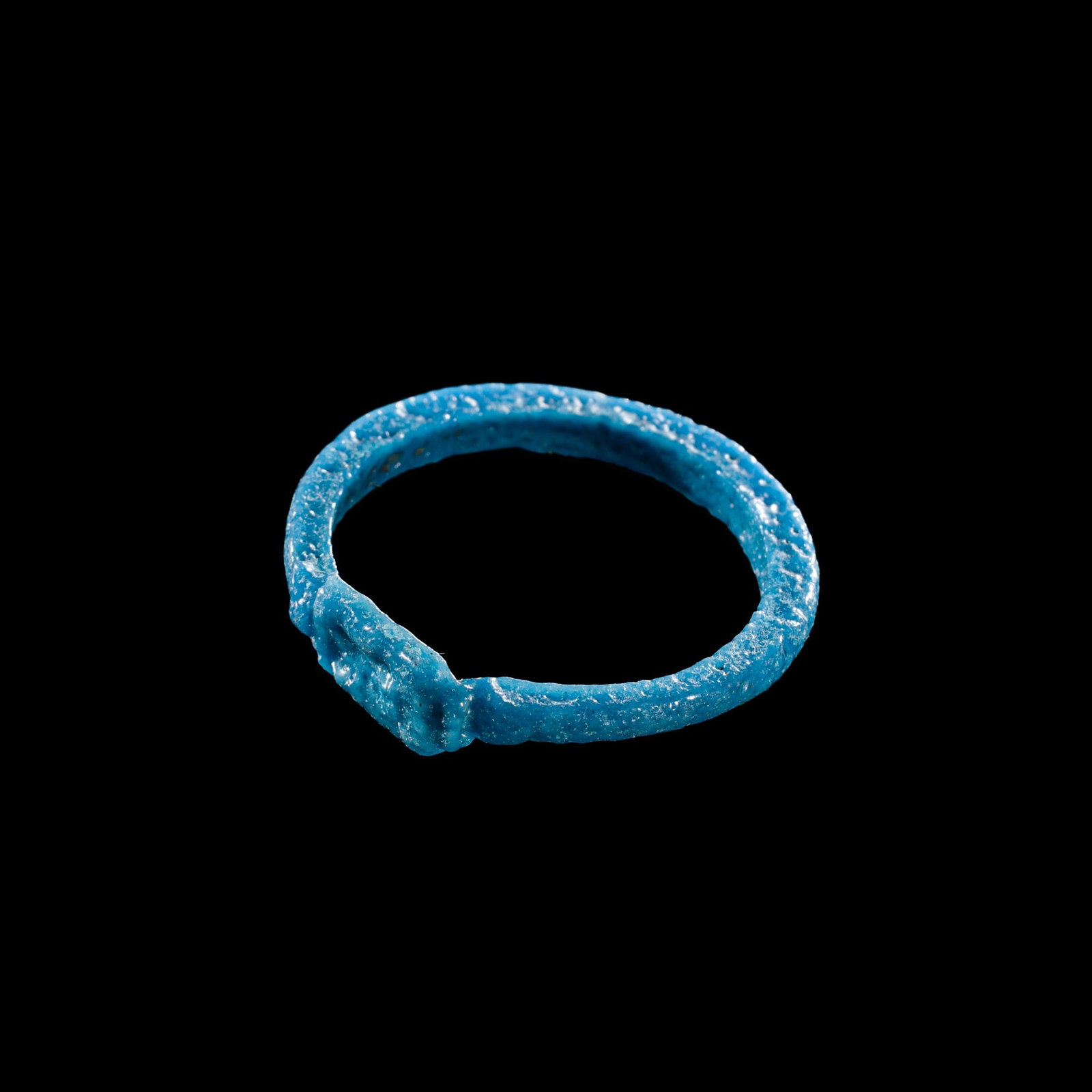 AN EGYPTIAN BLUE FAIENCE 'WEDJAT EYE' RING, NEW KINGDOM, DYNASTY XVIII (1 of 11)