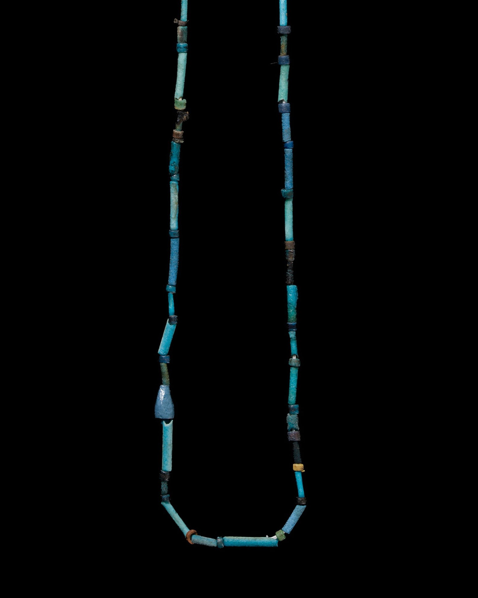 AN EGYPTIAN FAIENCE NECKLACE, LATE PERIOD: AN EGYPTIAN FAIENCE NECKLACE, LATE PERIOD This lot is from a single owner collection and is therefore offered without reserve The Jorgen Ruben Gallery Ledger, entry from 2012: “No. 728, Egyptian