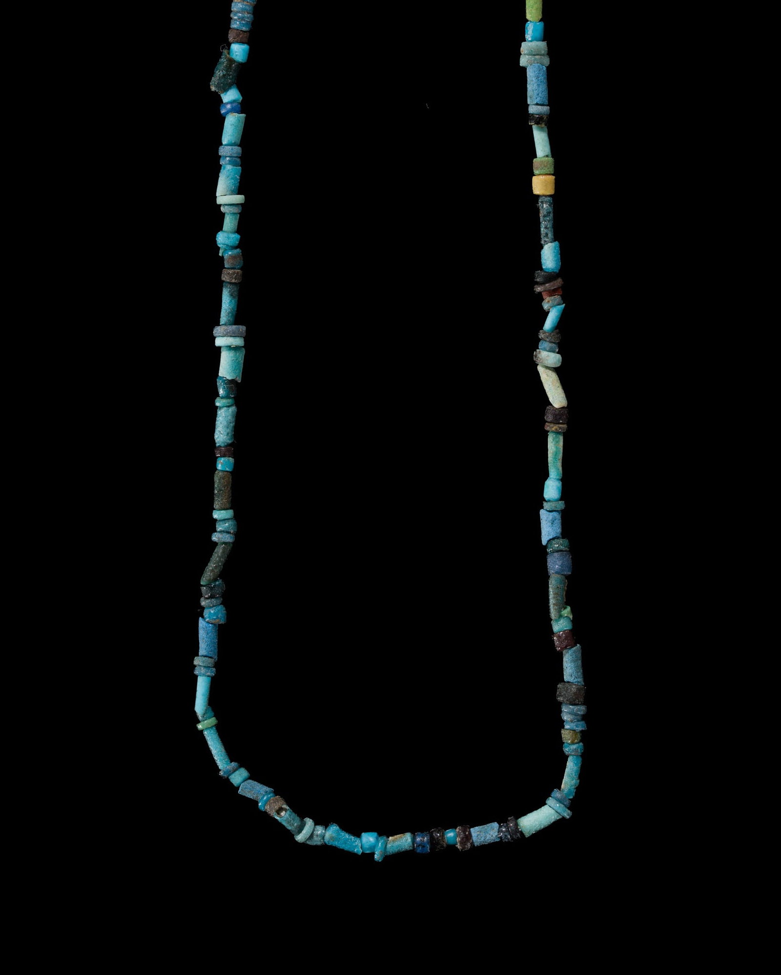 AN EGYPTIAN FAIENCE NECKLACE, LATE PERIOD: AN EGYPTIAN FAIENCE NECKLACE, LATE PERIOD This lot is from a single owner collection and is therefore offered without reserve The Jorgen Ruben Gallery Ledger, entry from 2012: “No. 728, Egyptian
