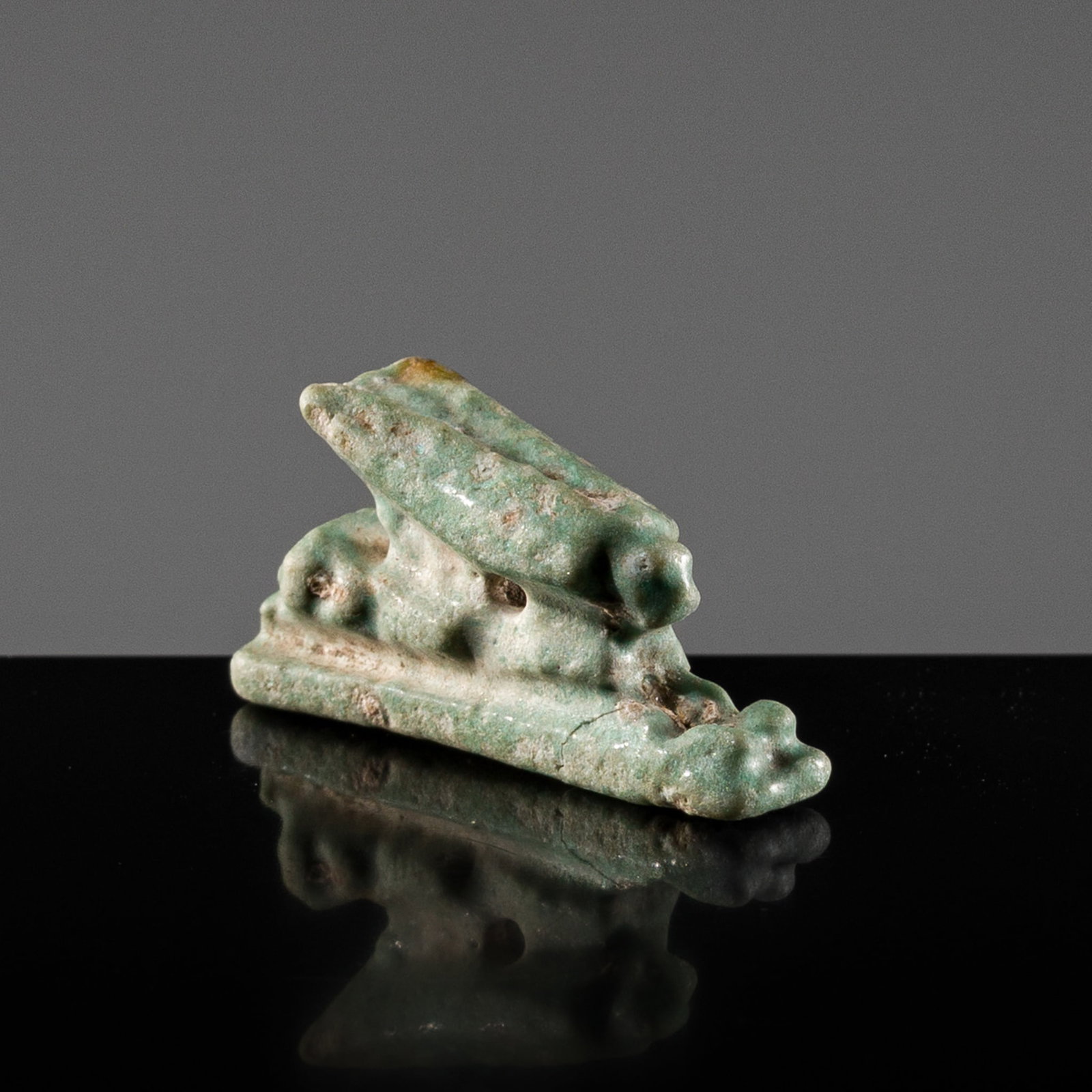 A PALE TURQUOISE FAIENCE 'HARE' AMULET, THIRD INTERMEDIATE PERIOD, DYNASTY XXI-XXV (1 of 13)