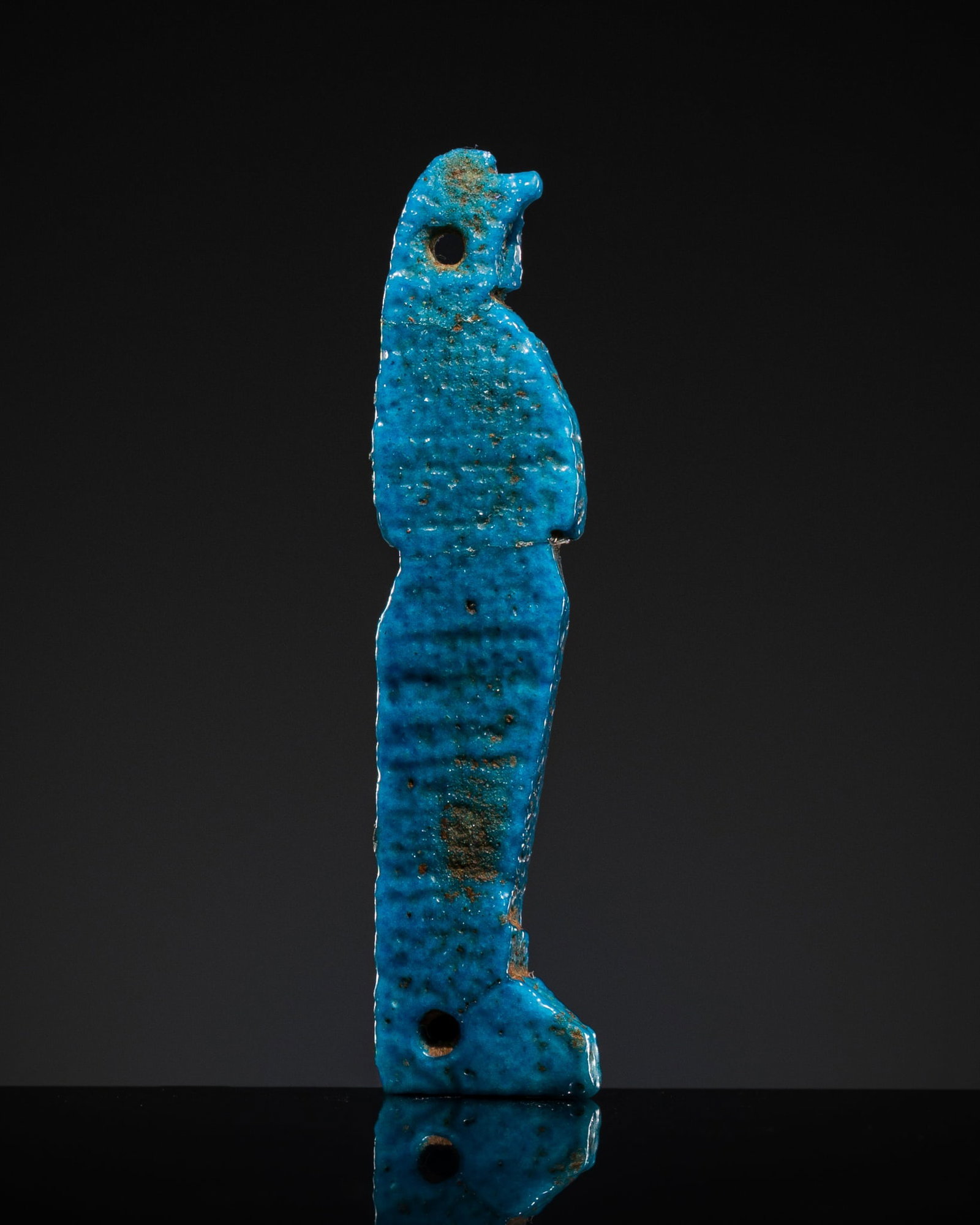 A TURQUOISE FAIENCE AMULET OF QEBEHSENUEF, THIRD INTERMEDIATE PERIOD-LATE PERIOD (1 of 13)