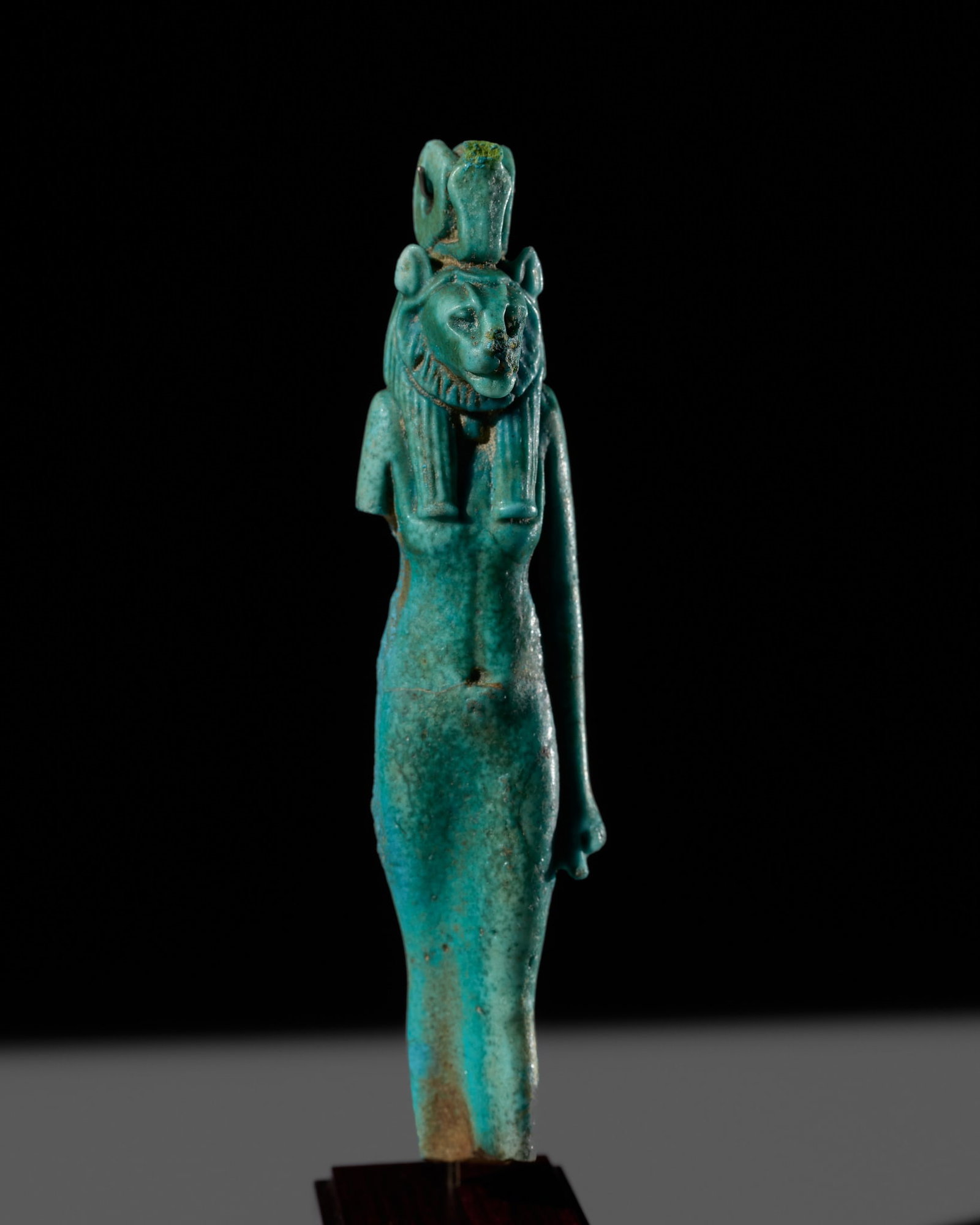 AN EGYPTIAN TURQUOISE FAIENCE 'SEKHMET' AMULET, THIRD INTERMEDIATE PERIOD-LATE PERIOD: AN EGYPTIAN TURQUOISE FAIENCE 'SEKHMET' AMULET, THIRD INTERMEDIATE PERIOD-LATE PERIOD This lot is from a single owner collection and is therefore offered without reserve Egypt, circa 1150-332 BC. Fine