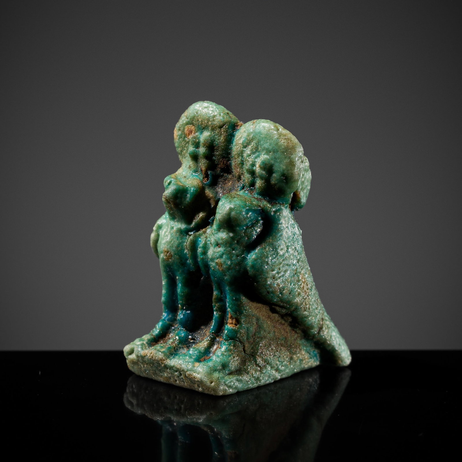 A TURQUOISE-GREEN FAIENCE DOUBLE BA BIRD AMULET, LATE PERIOD: A TURQUOISE-GREEN FAIENCE DOUBLE BA BIRD AMULET, LATE PERIOD This lot is from a single owner collection and is therefore offered without reserve Egypt, 664-332 BC. Well modeled, the pair of sacred bir