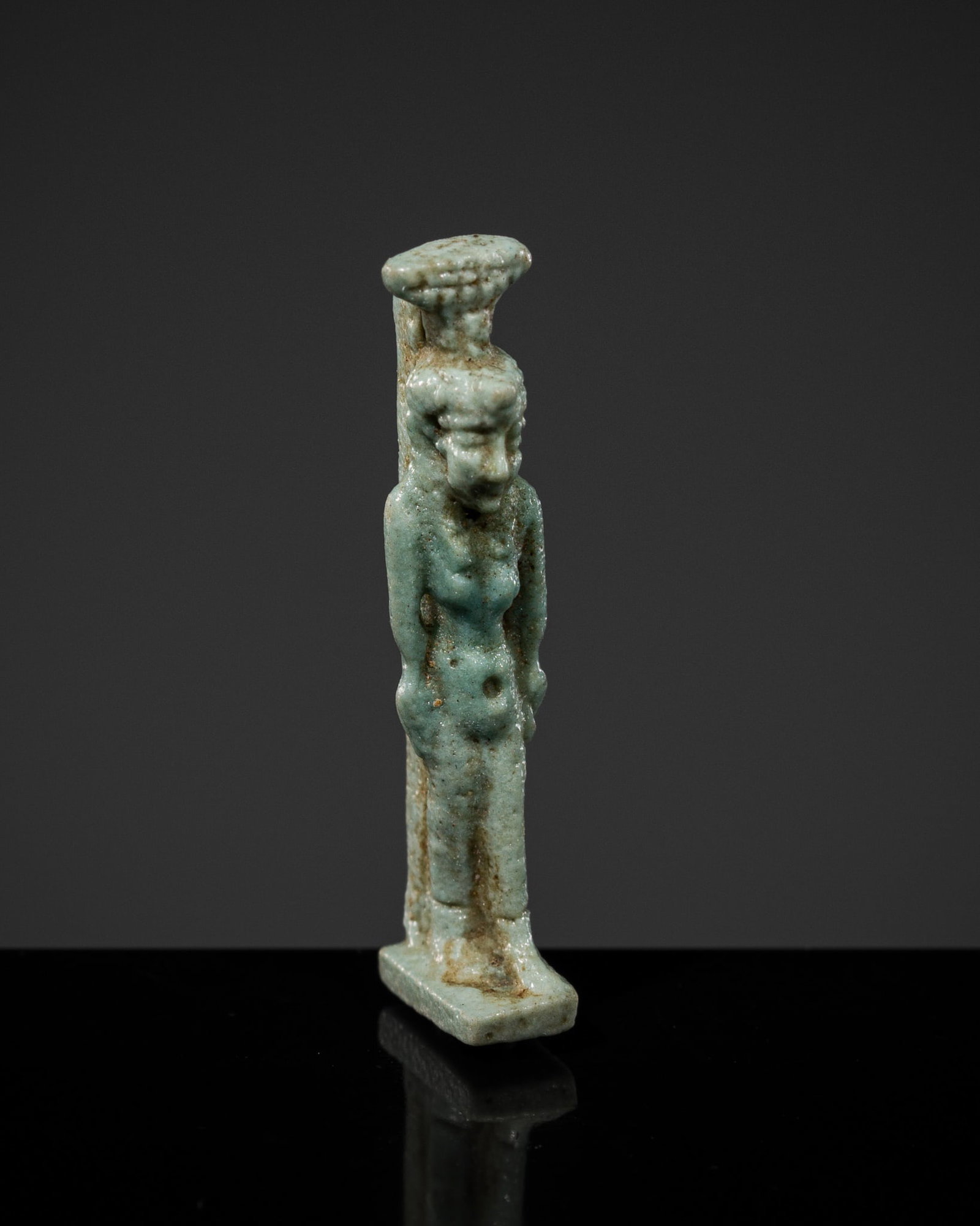 A RARE MINIATURE TURQUOISE FAIENCE AMULET OF NEPHTHYS, PTOLEMAIC PERIOD: A RARE MINIATURE TURQUOISE FAIENCE AMULET OF NEPHTHYS, PTOLEMAIC PERIOD This lot is from a single owner collection and is therefore offered without reserve Egypt, 332-30 BC. In the form of the goddess