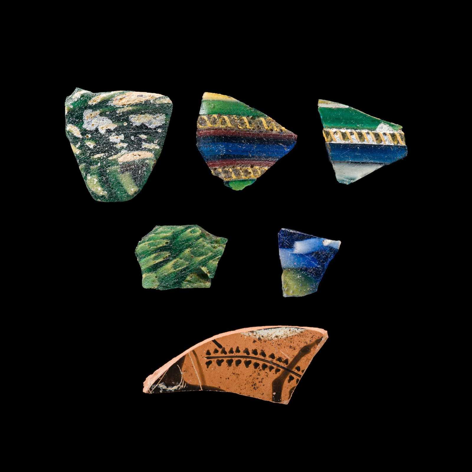 A GROUP OF FIVE ROMAN POLYCHROME GLASS FRAGMENTS AND ONE ATTIC TERRACOTTA FRAGMENT, CIRCA 1ST: A GROUP OF FIVE ROMAN POLYCHROME GLASS FRAGMENTS AND ONE ATTIC TERRACOTTA FRAGMENT, CIRCA 1ST CENTURY BC-1ST CENTURY AD AND EARLIER This lot is from a single owner collection and is therefore offered 