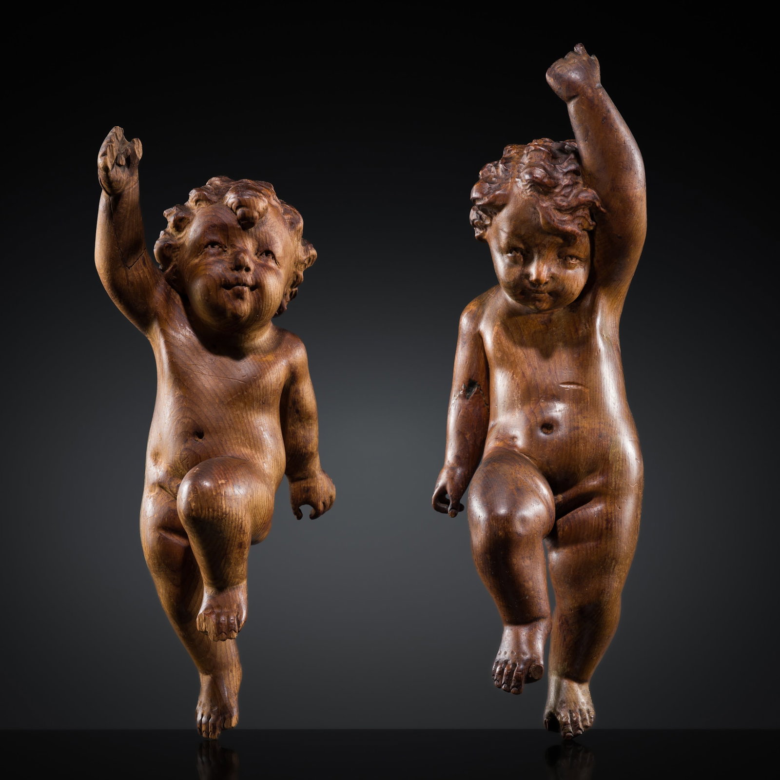 A PAIR OF FINELY CARVED WOOD FIGURES OF PUTTI, FRANCE, 17TH-18TH CENTURY: A PAIR OF FINELY CARVED WOOD FIGURES OF PUTTI, FRANCE, 17TH-18TH CENTURY This lot is from a single owner collection and is therefore offered without reserve The Jorgen Ruben Gallery Ledger, entry from