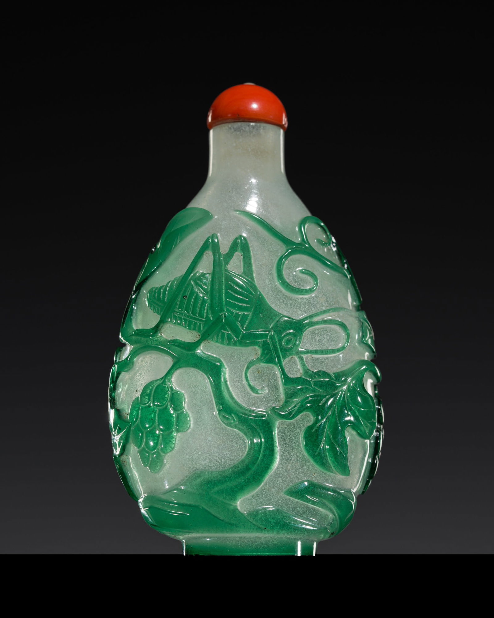 A PRISTINE GREEN-OVERLAY 'CRICKET AND GRAPES' SNOWFLAKE GLASS SNUFF BOTTLE, 1780-1850: A PRISTINE GREEN-OVERLAY 'CRICKET AND GRAPES' SNOWFLAKE GLASS SNUFF BOTTLE, 1780-1850 Published: on the homepage of Trudy and John Neville Cohen, no. B70 China. Of compressed ovoid form, supported on