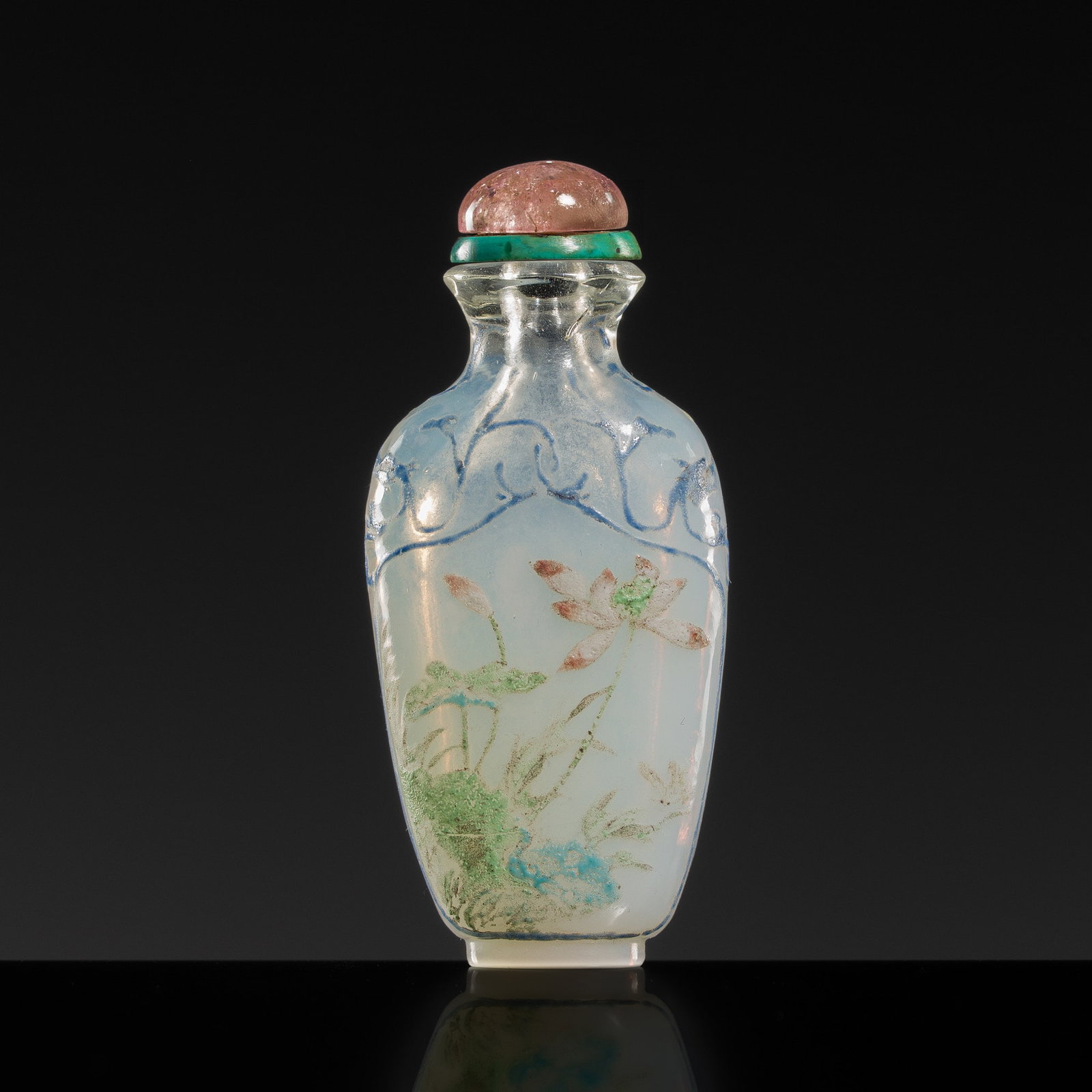 AN ENAMELED GLASS 'DRAGONS AND LOTUS' SNUFF BOTTLE, 18TH CENTURY: AN ENAMELED GLASS 'DRAGONS AND LOTUS' SNUFF BOTTLE, 18TH CENTURY China. The flattened baluster body supported on an oval foot and rising to a waisted neck with an everted rim. The exterior enameled in