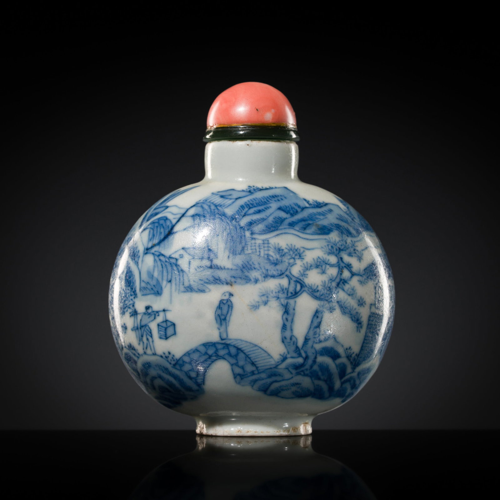 A BLUE AND WHITE 'IDYLLIC LANDSCAPE' PORCELAIN SNUFF BOTTLE, 1750-1850: A BLUE AND WHITE 'IDYLLIC LANDSCAPE' PORCELAIN SNUFF BOTTLE, 1750-1850 China. Of compressed globular form raised on an oval foot and rising to a cylindrical neck with flat lip, the sides decorated in 