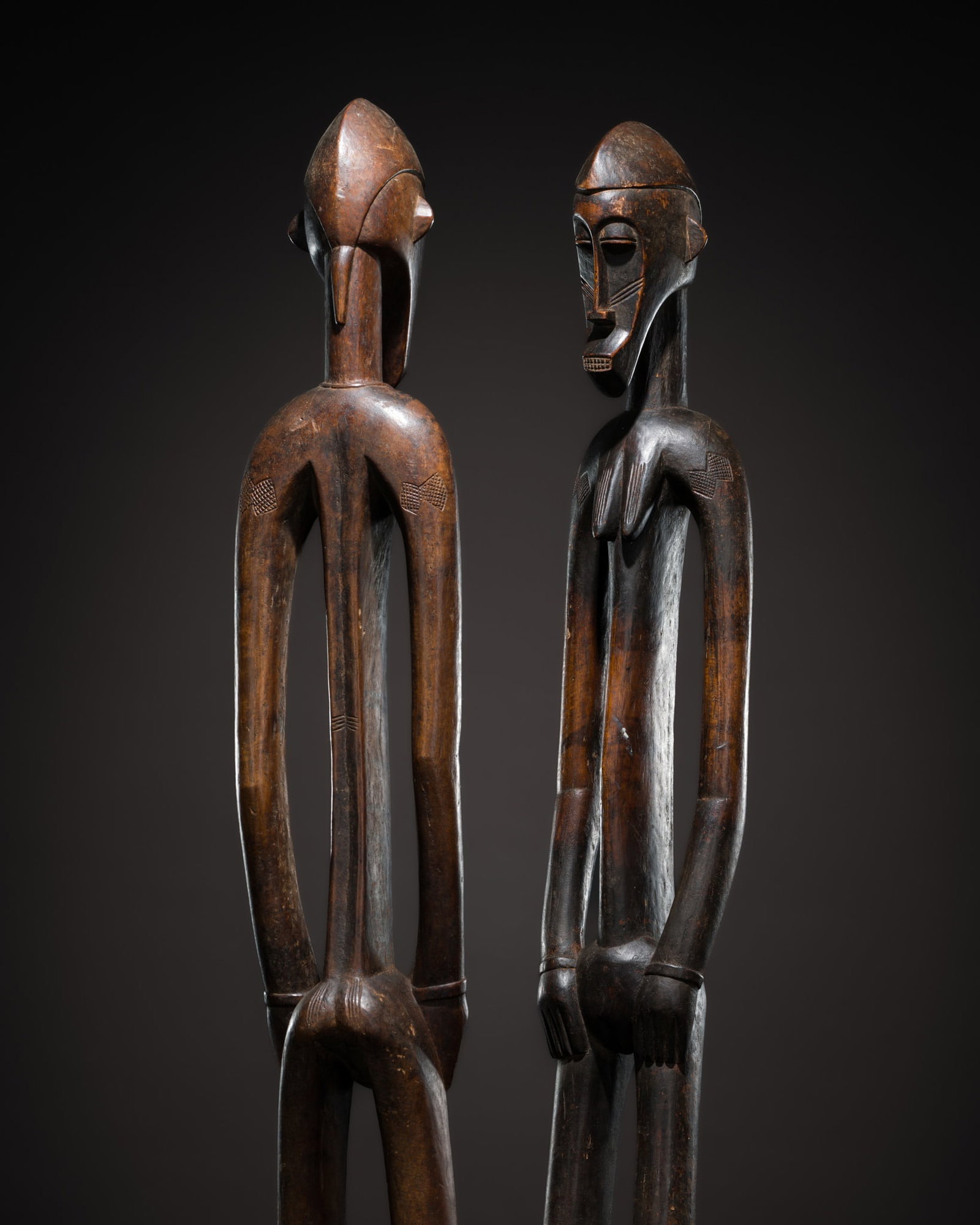 A PAIR OF LARGE WOOD SENUFO FIGURES, IVORY COAST, LATE 19TH TO MID-20TH CENTURY (1 of 11)