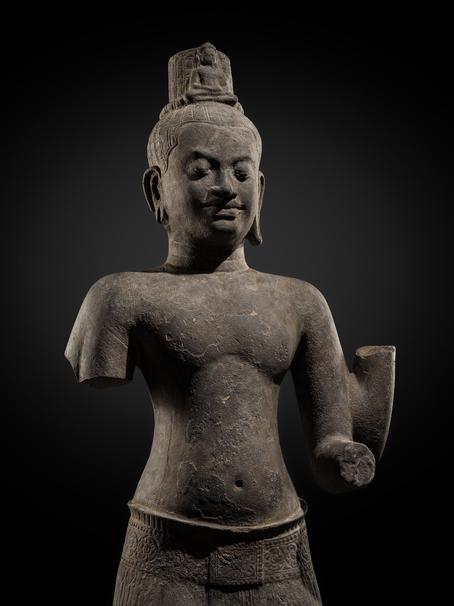 A LARGE AND IMPRESSIVE SANDSTONE FIGURE OF AVALOKITESHVARA, ANGKOR PERIOD, BAYON STYLE, 12TH-13TH: A LARGE AND IMPRESSIVE SANDSTONE FIGURE OF AVALOKITESHVARA, ANGKOR PERIOD, BAYON STYLE, 12TH-13TH CENTURY This lot is from a single owner collection and is therefore offered without reserve Khmer Empi