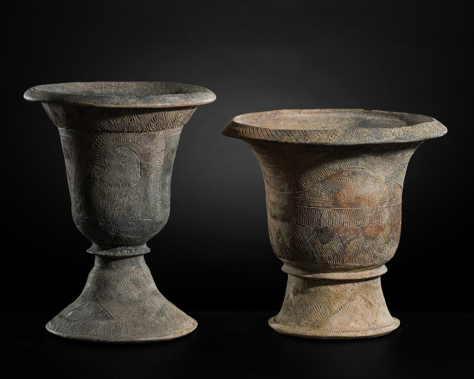 A GROUP OF TWO INCISED POTTERY URNS, BAN CHIANG, 3600-1000 BC: A GROUP OF TWO INCISED POTTERY URNS, BAN CHIANG, 3600-1000 BC This lot is from a single owner collection and is therefore offered without reserve Thailand, Udon Thani Province. Each of ovoid form rais