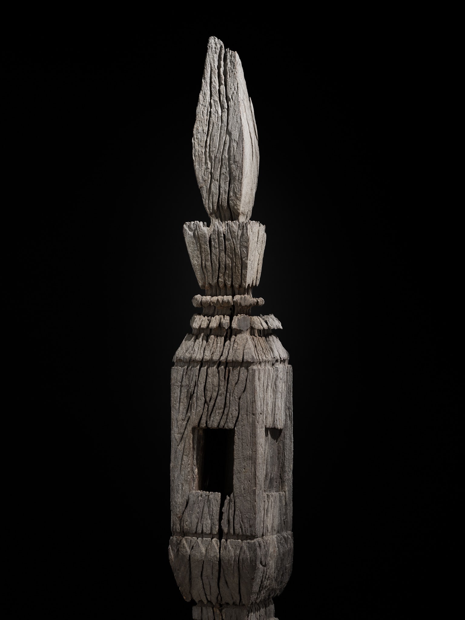 A MONUMENTAL (209 CM) TEAK WOOD ANCESTOR POLE, THAT MAI, 19TH CENTURY: A MONUMENTAL (209 CM) TEAK WOOD ANCESTOR POLE, THAT MAI, 19TH CENTURY This lot is from a single owner collection and is therefore offered without reserve Thailand, Isan Province. Skillfully carved, of