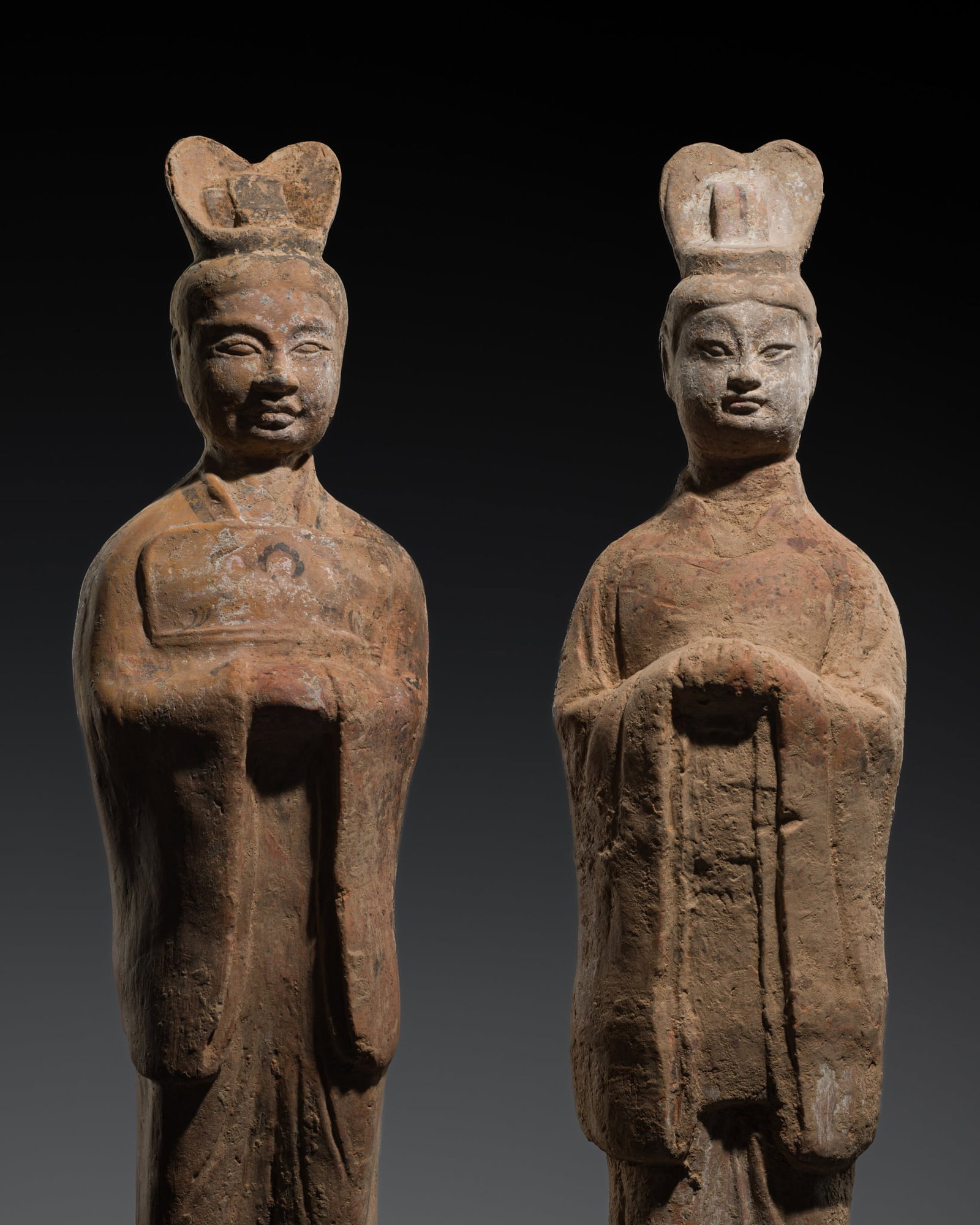A PAIR OF LARGE POTTERY FIGURES OF COURT OFFICIALS, TANG DYNASTY: A PAIR OF LARGE POTTERY FIGURES OF COURT OFFICIALS, TANG DYNASTY This lot is from a single owner collection and is therefore offered without reserve China, 618-907. Each finely modeled to depict a civ