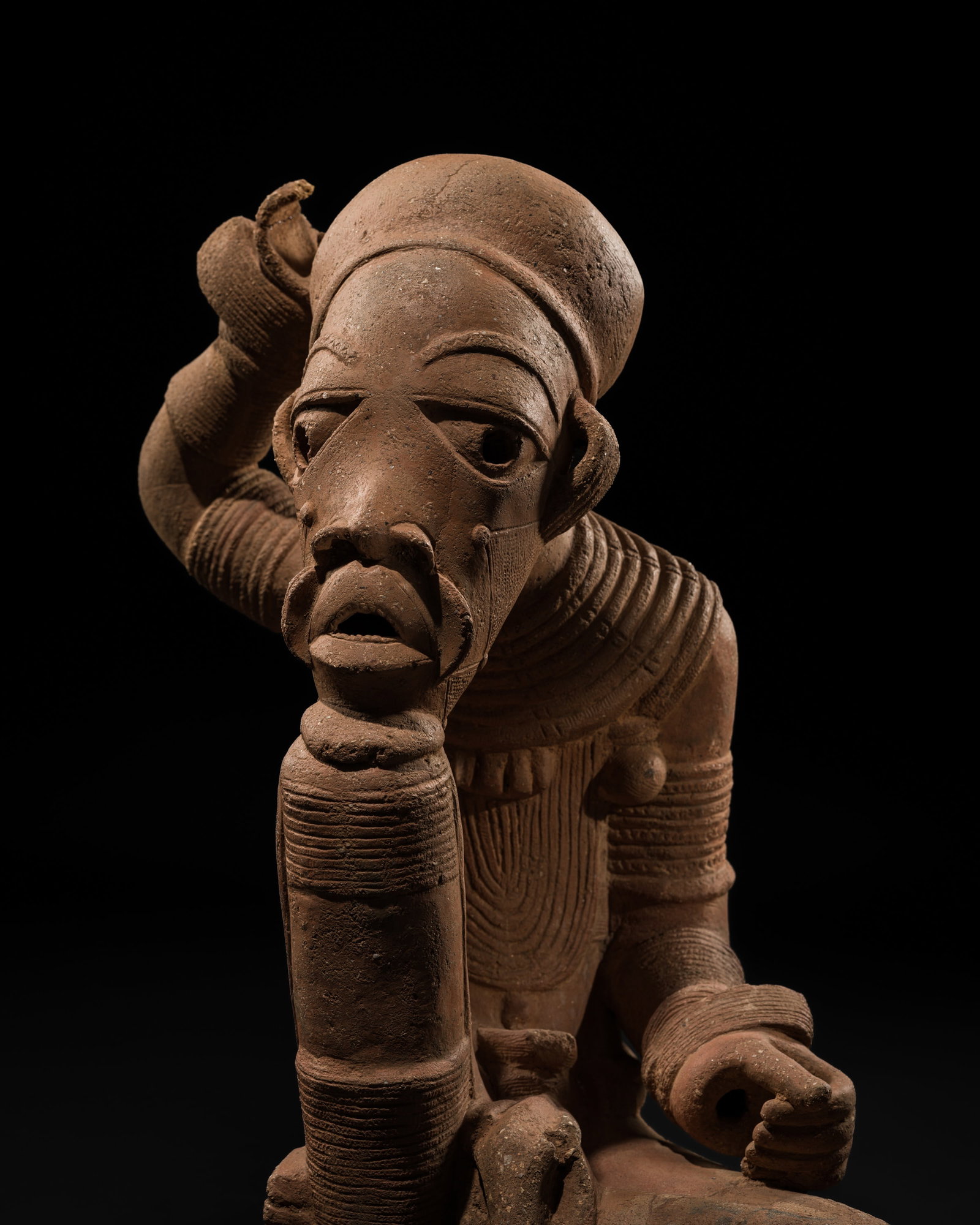 A LARGE TERRACOTTA FIGURE OF A MALE DEITY, NOK CULTURE, NIGERIA, 500 BC-200 AD: A LARGE TERRACOTTA FIGURE OF A MALE DEITY, NOK CULTURE, NIGERIA, 500 BC-200 AD This lot is from a single owner collection and is therefore offered without reserve Scientific Analysis Report: A thermol