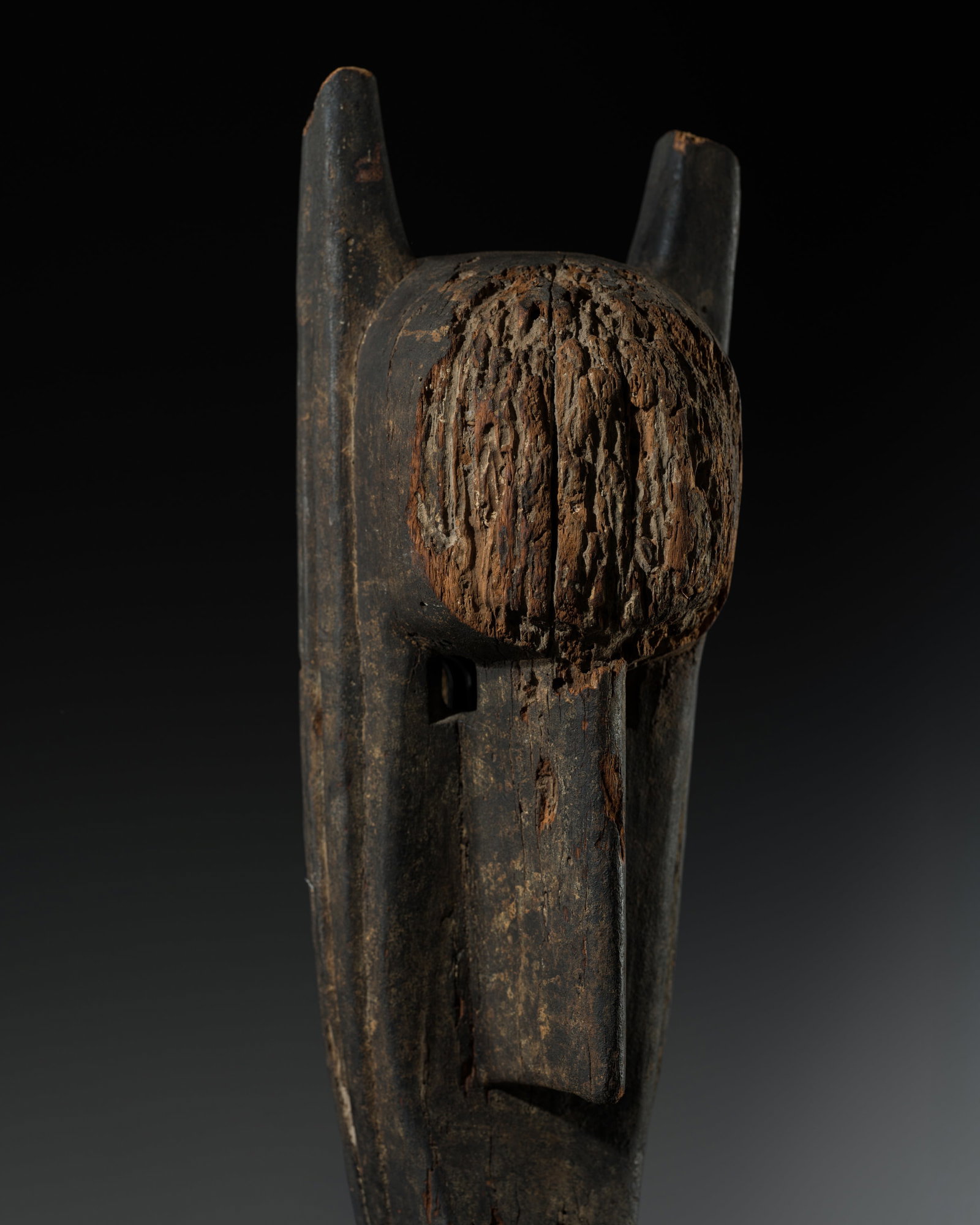 A BAMANA WOOD 'HYENA' MASK, SURUKU, LATE 19TH-EARLY 20TH CENTURY: A BAMANA WOOD 'HYENA' MASK, SURUKU, LATE 19TH-EARLY 20TH CENTURY This lot is from a single owner collection and is therefore offered without reserve Mali. The elongated face rendered with a high foreh