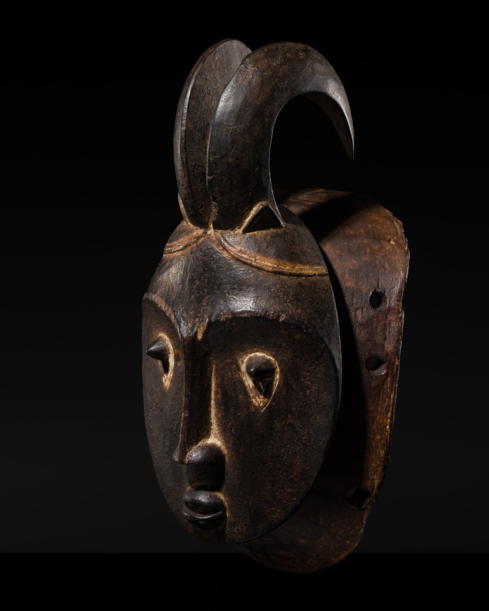 A BAULE WOOD MASK FOR THE GOLI MASQUERADE, KPWAN KPLE, FIRST HALF OF 20TH CENTURY: A BAULE WOOD MASK FOR THE GOLI MASQUERADE, KPWAN KPLE, FIRST HALF OF 20TH CENTURY This lot is from a single owner collection and is therefore offered without reserve Côte d'Ivoire. Boldly carved,