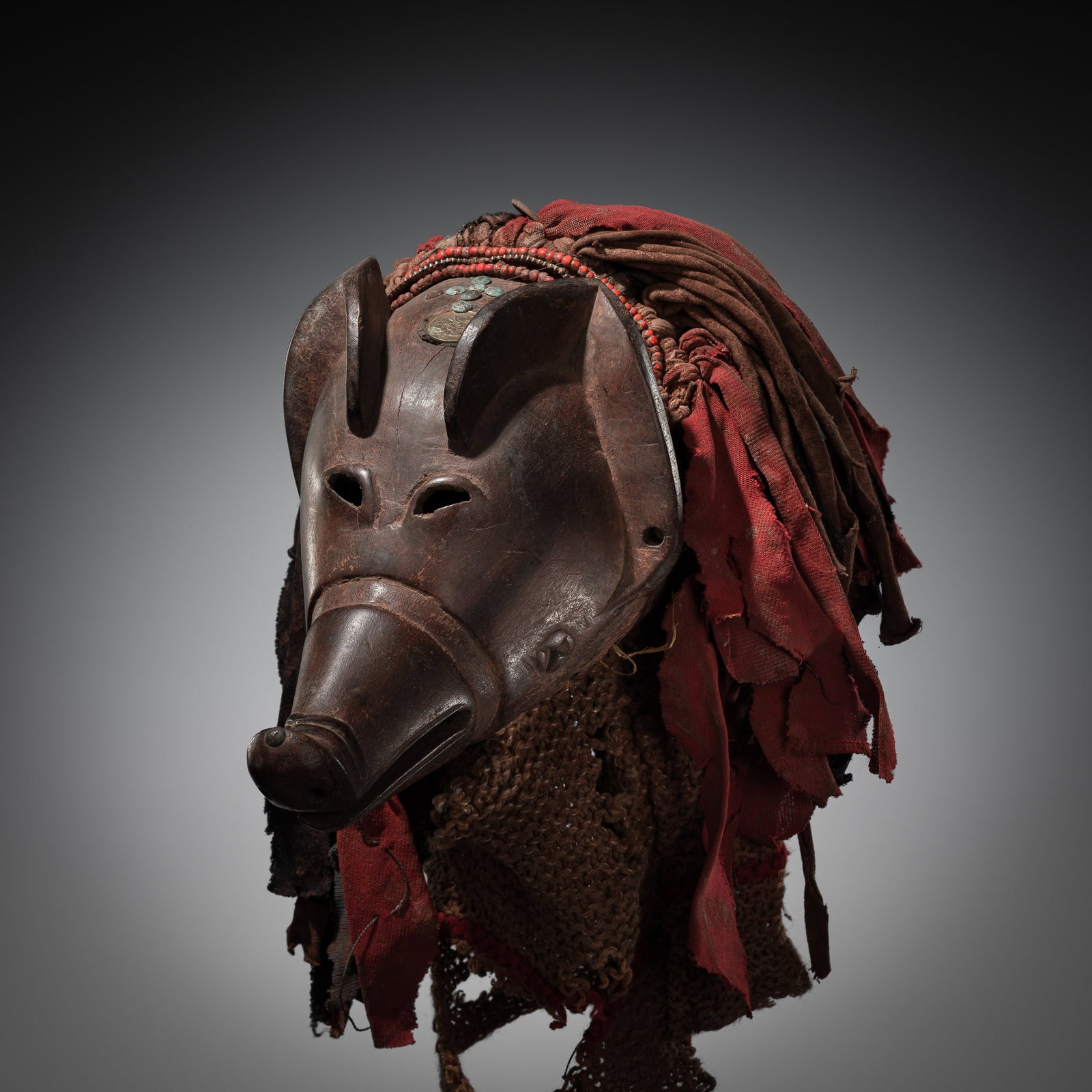 A FINE CHOKWE WOOD 'PIG' MASK, NGULU, 20TH CENTURY (1 of 14)