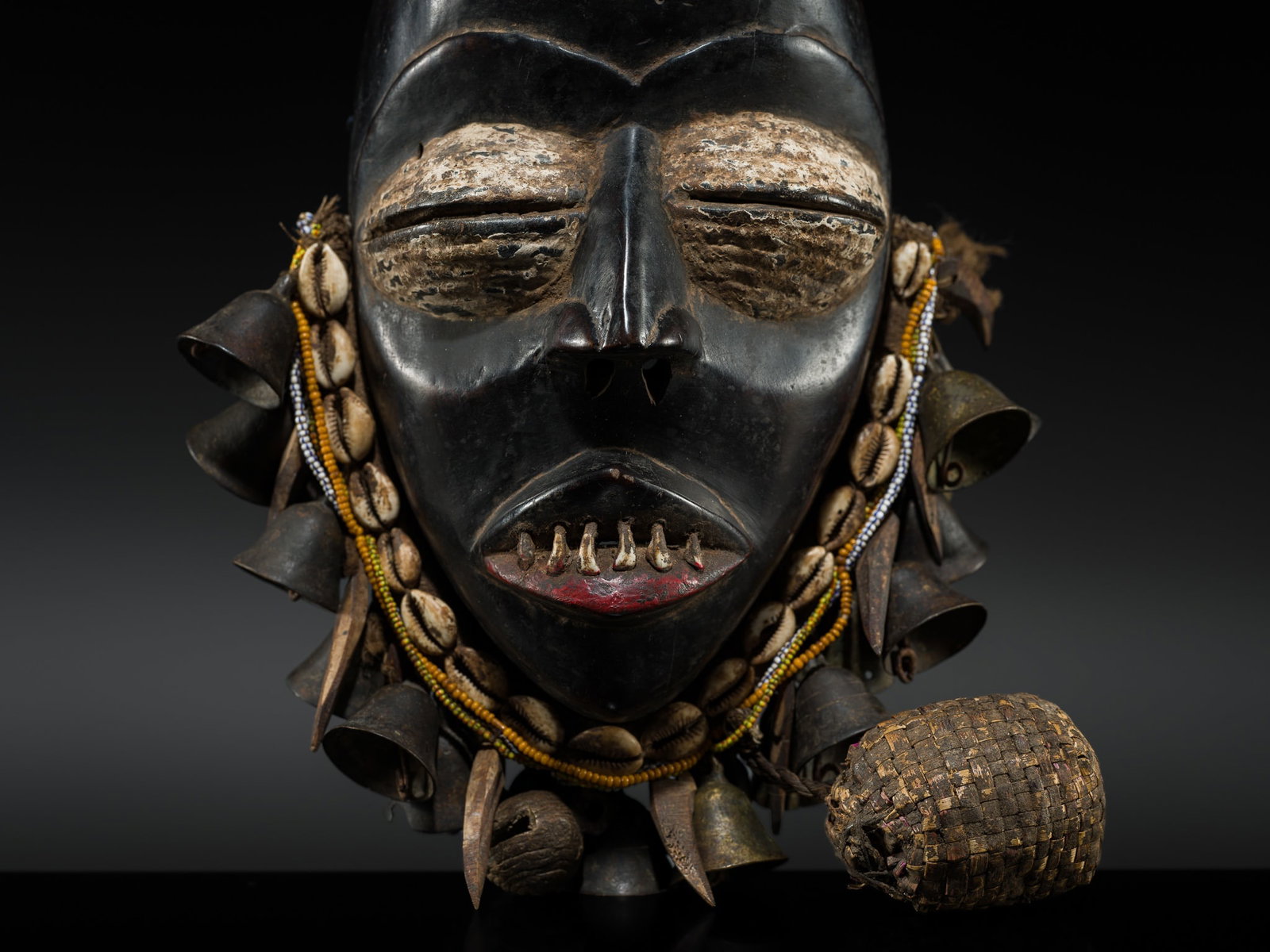 A GUERE MASK, MID-20TH CENTURY: A GUERE MASK, MID-20TH CENTURY This lot is from a single owner collection and is therefore offered without reserve Côte d'Ivoire. Carved with a high domed forehead, sharply arched brows, heavy pr