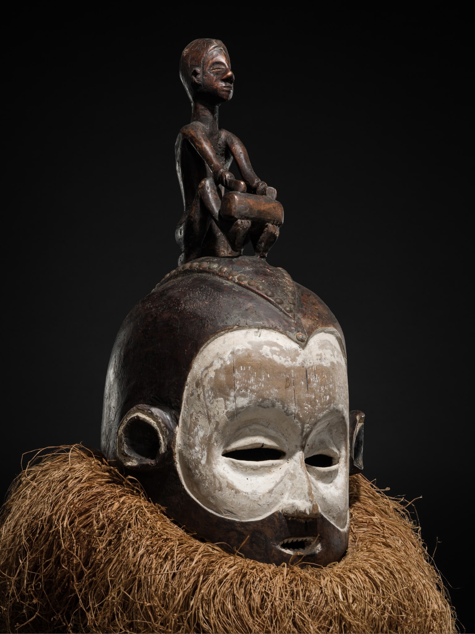A RARE SUKU WOOD HELMET MASK, HEMBA, LATE 19TH-EARLY 20TH CENTURY: A RARE SUKU WOOD HELMET MASK, HEMBA, LATE 19TH-EARLY 20TH CENTURY This lot is from a single owner collection and is therefore offered without reserve Democratic Republic of the Congo. Carved as a huma