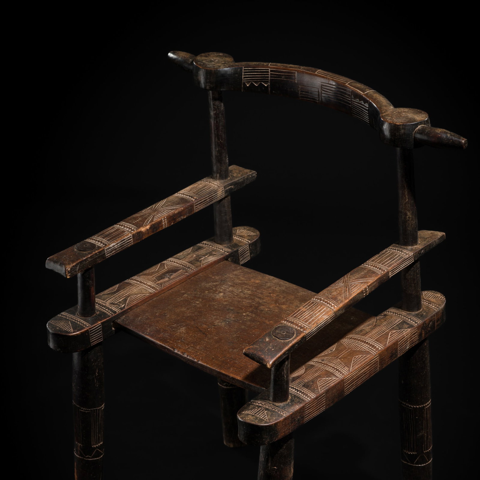 A SENUFO WOOD CHAIR, 20TH CENTURY: A SENUFO WOOD CHAIR, 20TH CENTURY This lot is from a single owner collection and is therefore offered without reserve Côte d'Ivoire. Finely crafted from multiple individually carved elements, sup