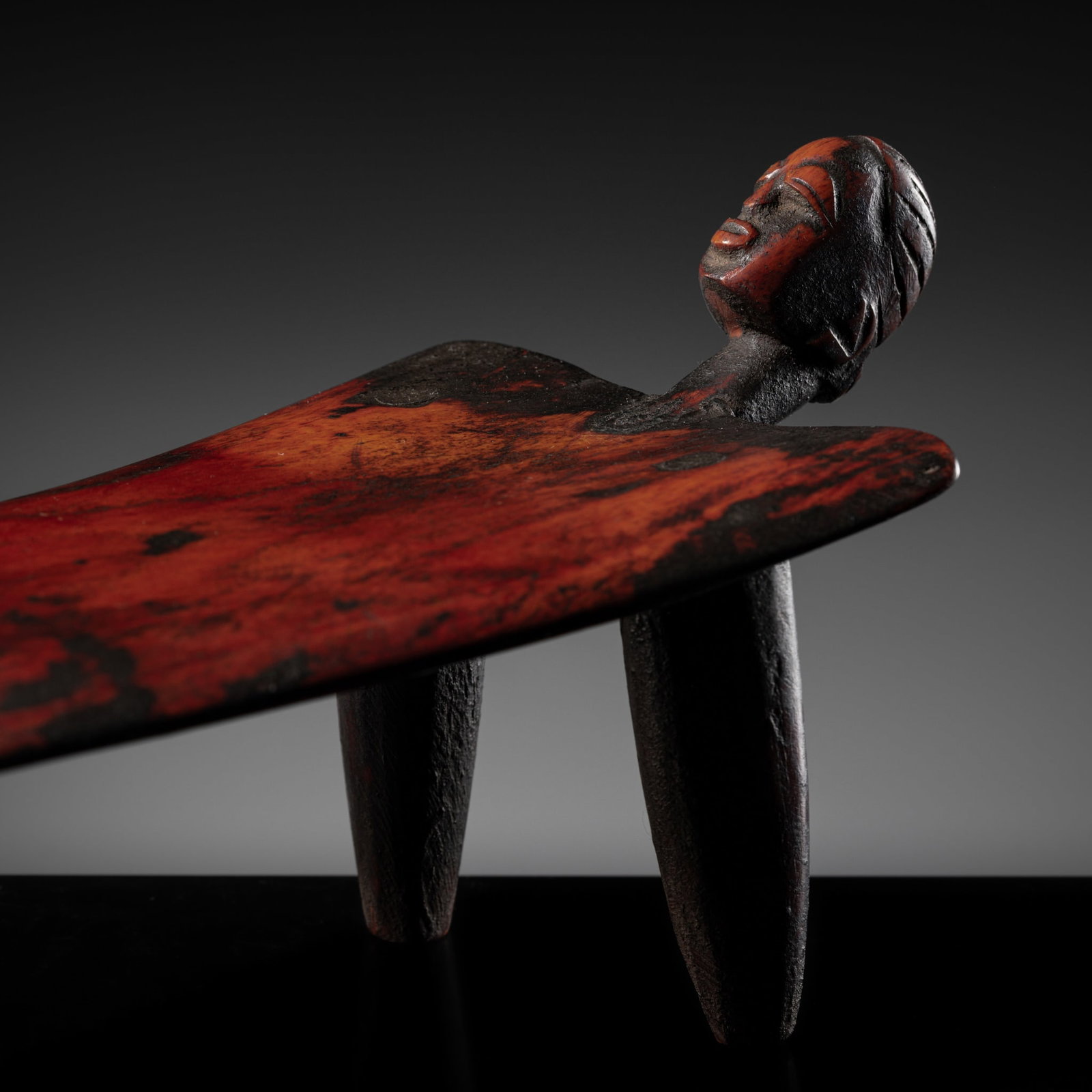 A LOBI WOOD THREE-LEGGED FIGURAL STOOL, LATE 19TH-20TH CENTURY (1 of 11)