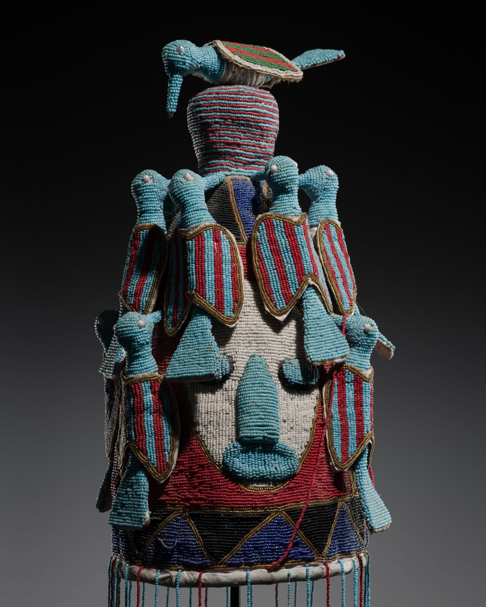 A FINE YORUBA POLYCHROME BEADED CROWN, ADENLA, MID-20TH CENTURY: A FINE YORUBA POLYCHROME BEADED CROWN, ADENLA, MID-20TH CENTURY This lot is from a single owner collection and is therefore offered without reserve Nigeria. Of cylindrical form, tapering towards the t