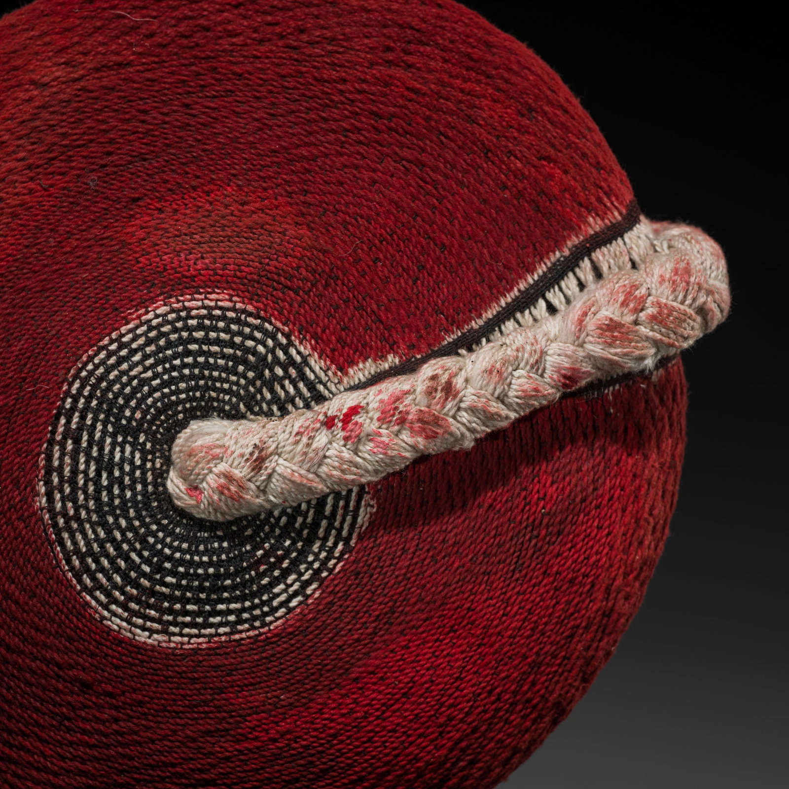 A ZULU DYED FIBER WOMAN'S HAT, ISICHOLO, 20TH CENTURY: A ZULU DYED FIBER WOMAN'S HAT, ISICHOLO, 20TH CENTURY This lot is from a single owner collection and is therefore offered without reserve South Africa. Of characteristic disk shape, made of braided th