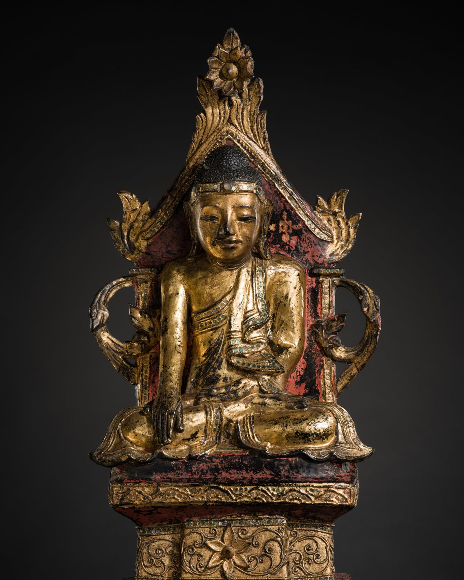 A GILT-LACQUERED WOOD FIGURE OF THE ENTHRONED BUDDHA SHAKYAMUNI, BURMA, 19TH CENTURY: A GILT-LACQUERED WOOD FIGURE OF THE ENTHRONED BUDDHA SHAKYAMUNI, BURMA, 19TH CENTURY This lot is from a single owner collection and is therefore offered without reserve Myanmar. Finely carved and lacq