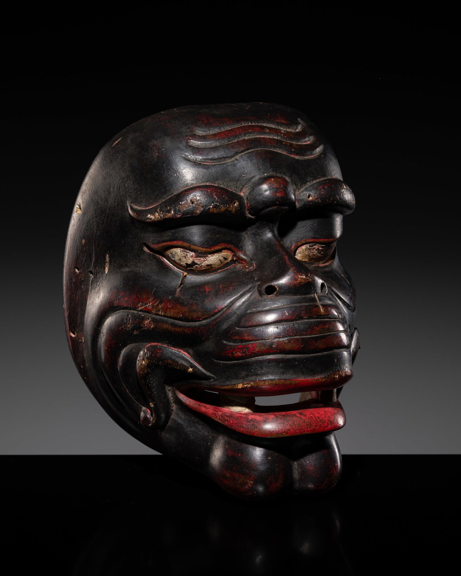 A BALINESE POLYCHROME WOOD 'TOPENG' DANCE MASK (1 of 12)
